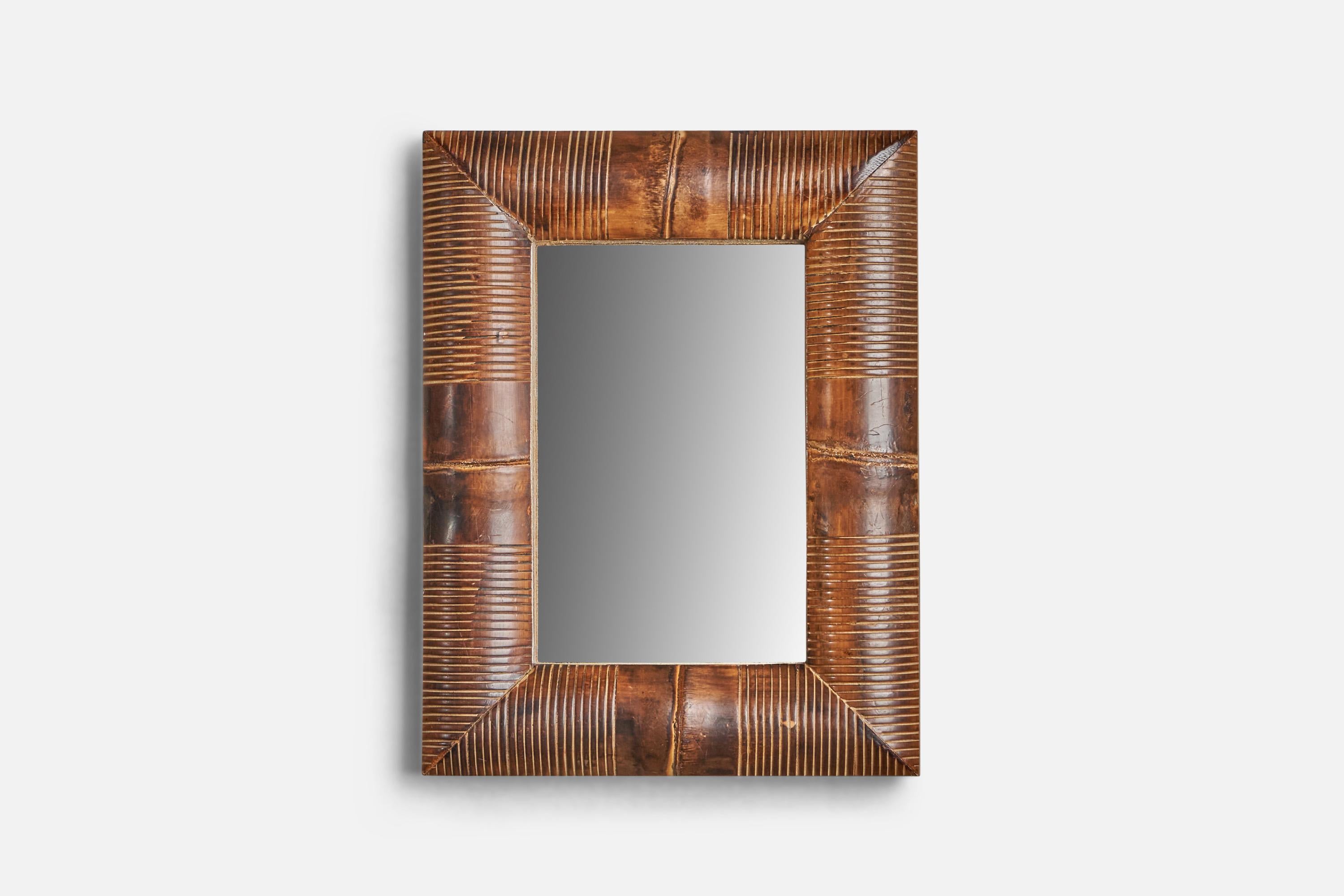 A small carved wood wall or table mirror designed and produced in Italy, c. 1940s.
With mountings for either wall or table top.