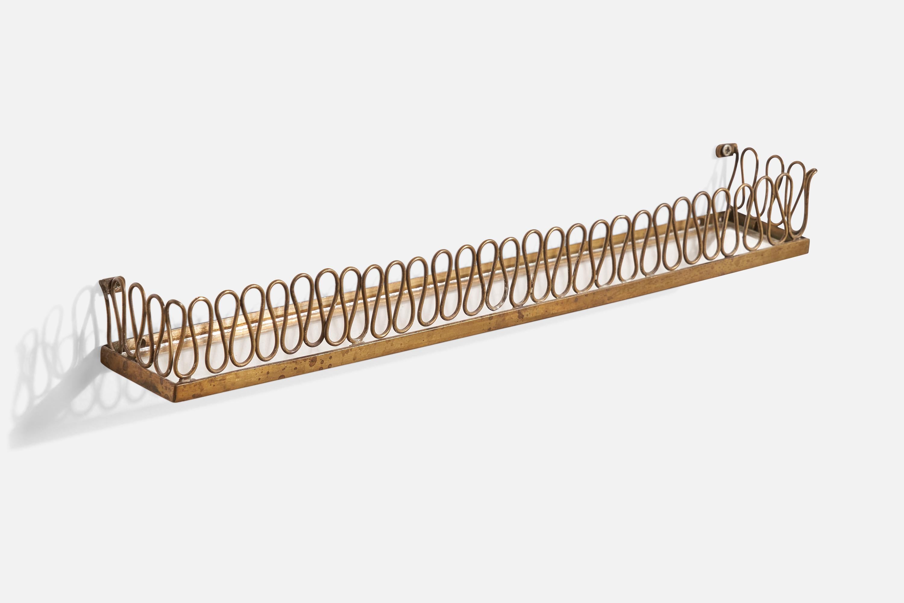 A very small brass and glass wall shelf designed and produced in Italy, c. 1930s.

Dimensions: 2” H x 16.625” W x 2.5” D
