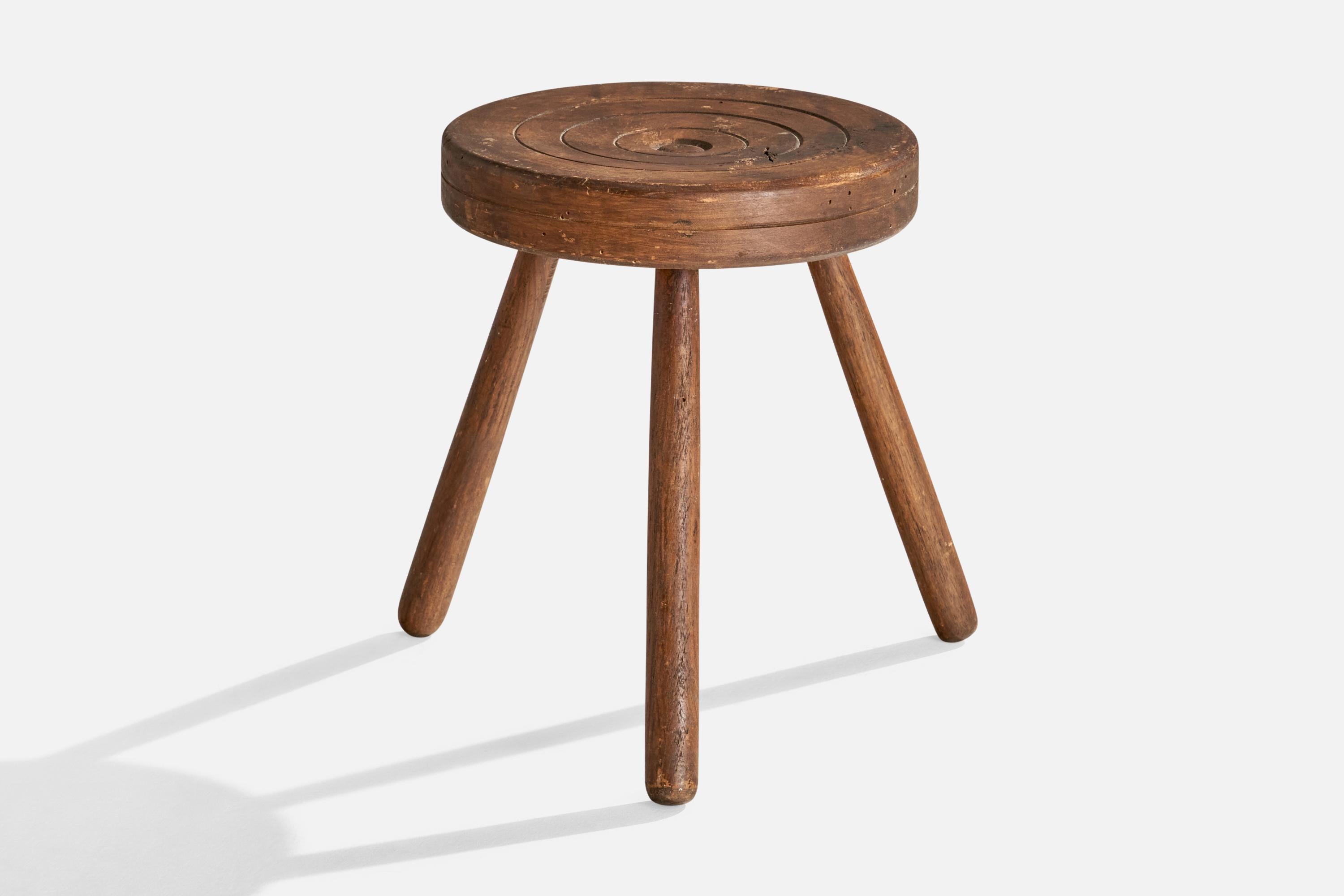A wood stool designed and produced in Italy, c. 1940s.

Seat height: 13.5