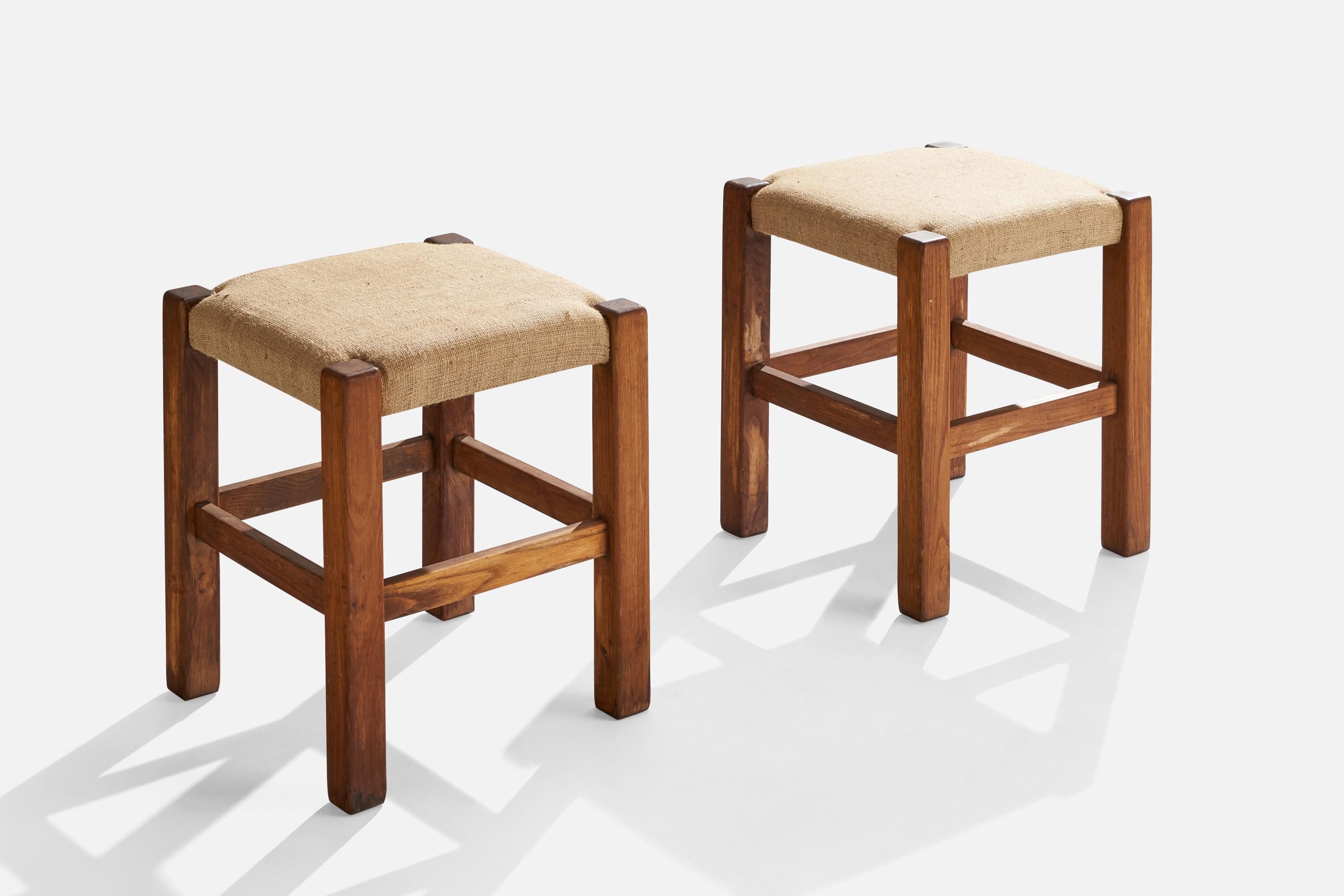 A pair of stained oak and raffia stools designed and produced in Italy, c. 1960s.

Seat height: 19.25”
