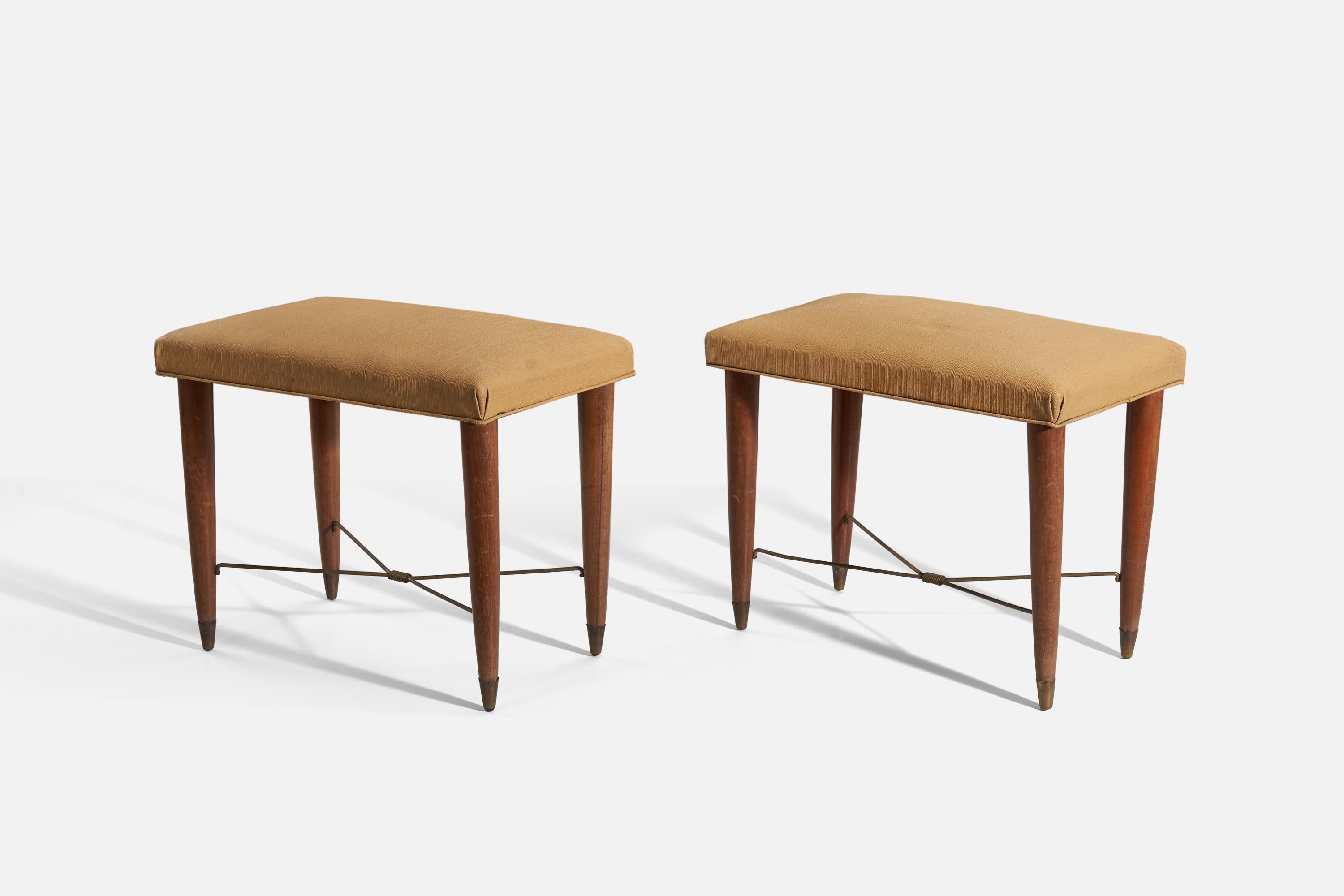 A pair of walnut, brass and yellow fabric stools, designed and produced in Italy, 1940s.

