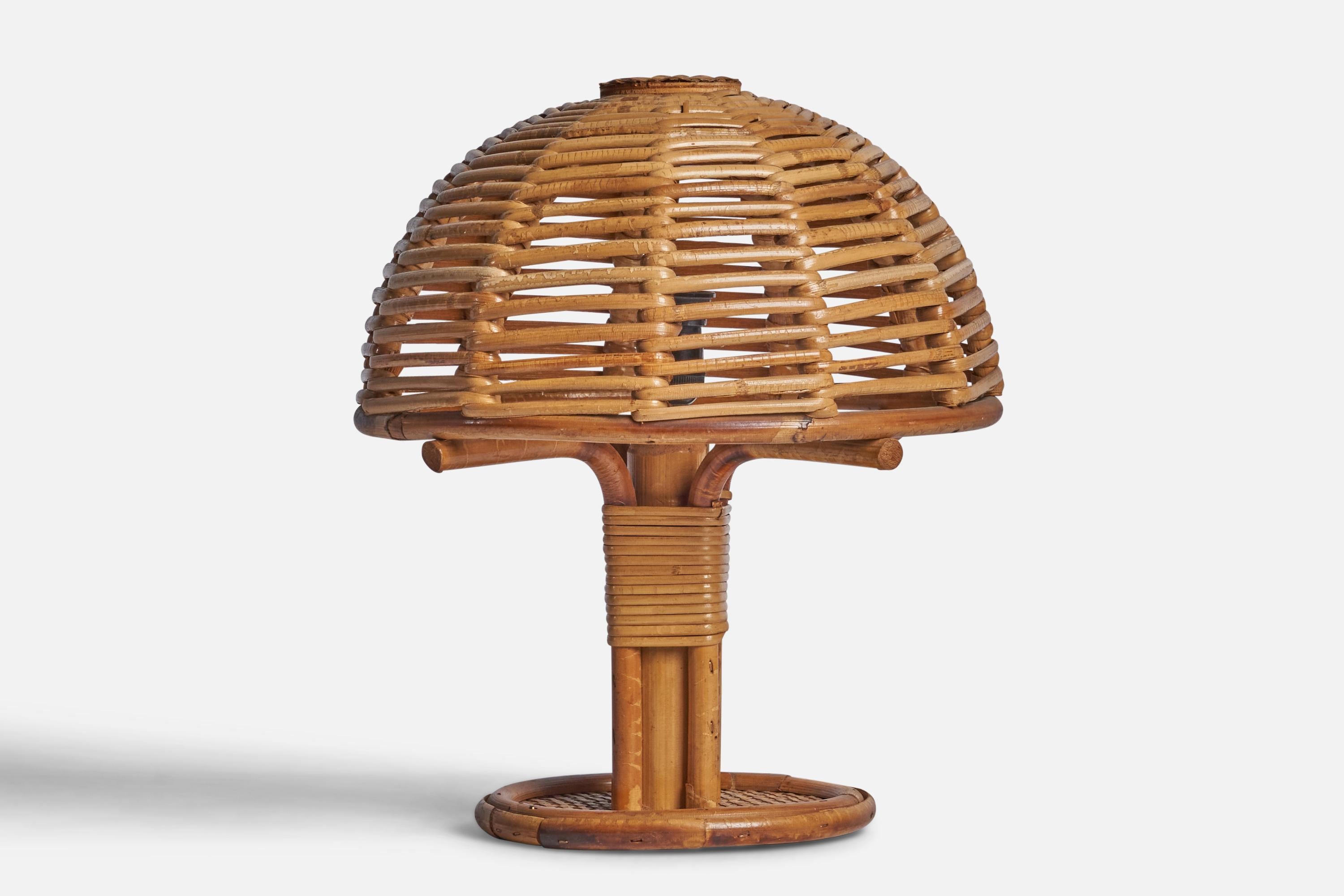 A moulded bamboo and rattan table lamp designed and produced in Italy, 1970s.

Overall Dimensions (inches): 11.5” H x 10” Diameter
Bulb Specifications: E-14 Bulb
Number of Sockets: 1
All lighting will be converted for US usage. We are unable to