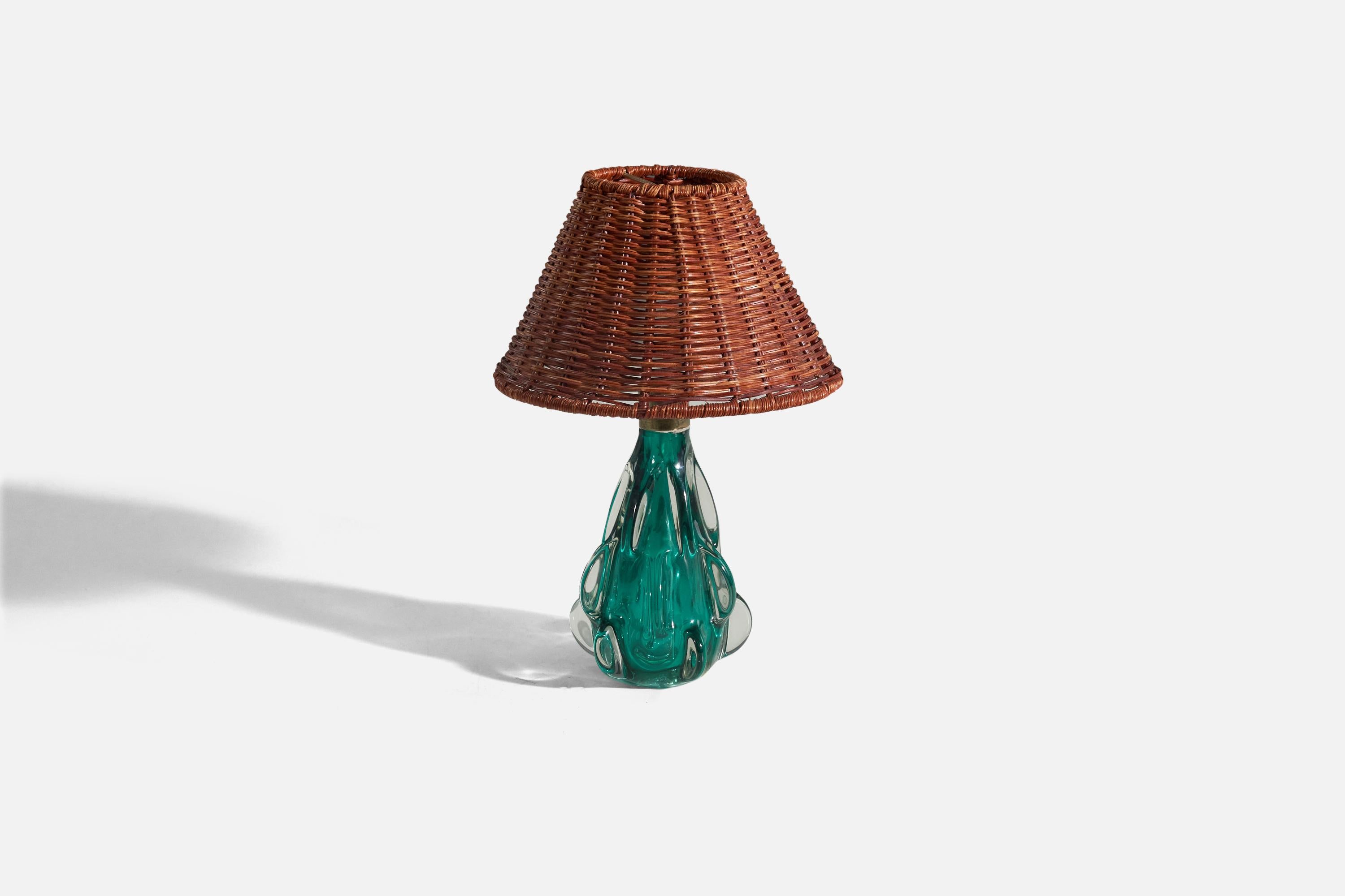 A blue Murano glass table lamp designed and produced in Murano, Italy, c. 1950s. 

Sold without lampshade. 
Dimensions of lamp (inches) : 9.56 x 4.65 x 4.56 (Height x Width x Depth)
Dimensions of shade (inches) : 3.5 x 8 x 5.37 (Top Diameter x