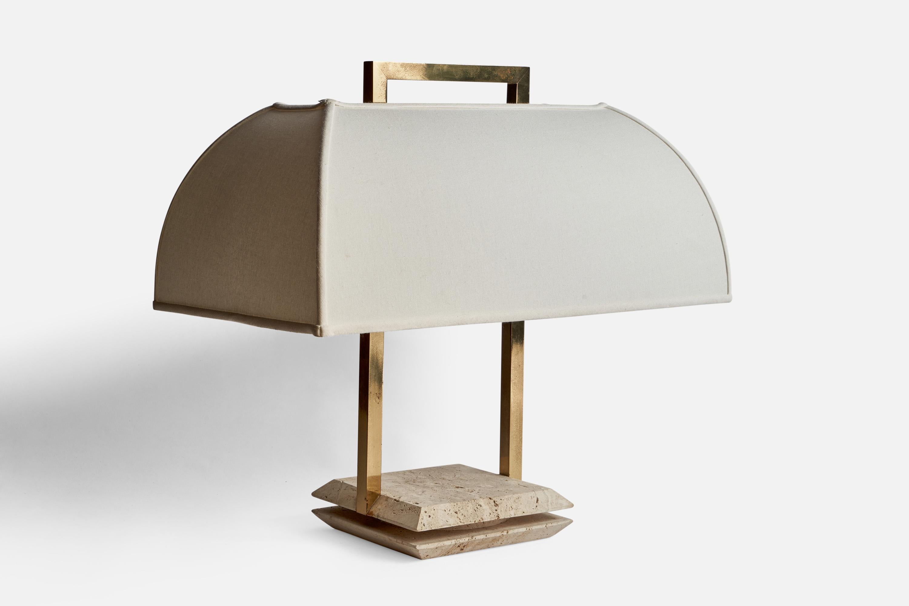 A sizeable brass, travertine and white fabric table lamp designed and produced in Italy, 1970s.

Overall Dimensions (inches): 19.55” H x 20.38” W x 12.38” D
Bulb Specifications: E-26 Bulbs
Number of Sockets: 2
All lighting will be converted for US