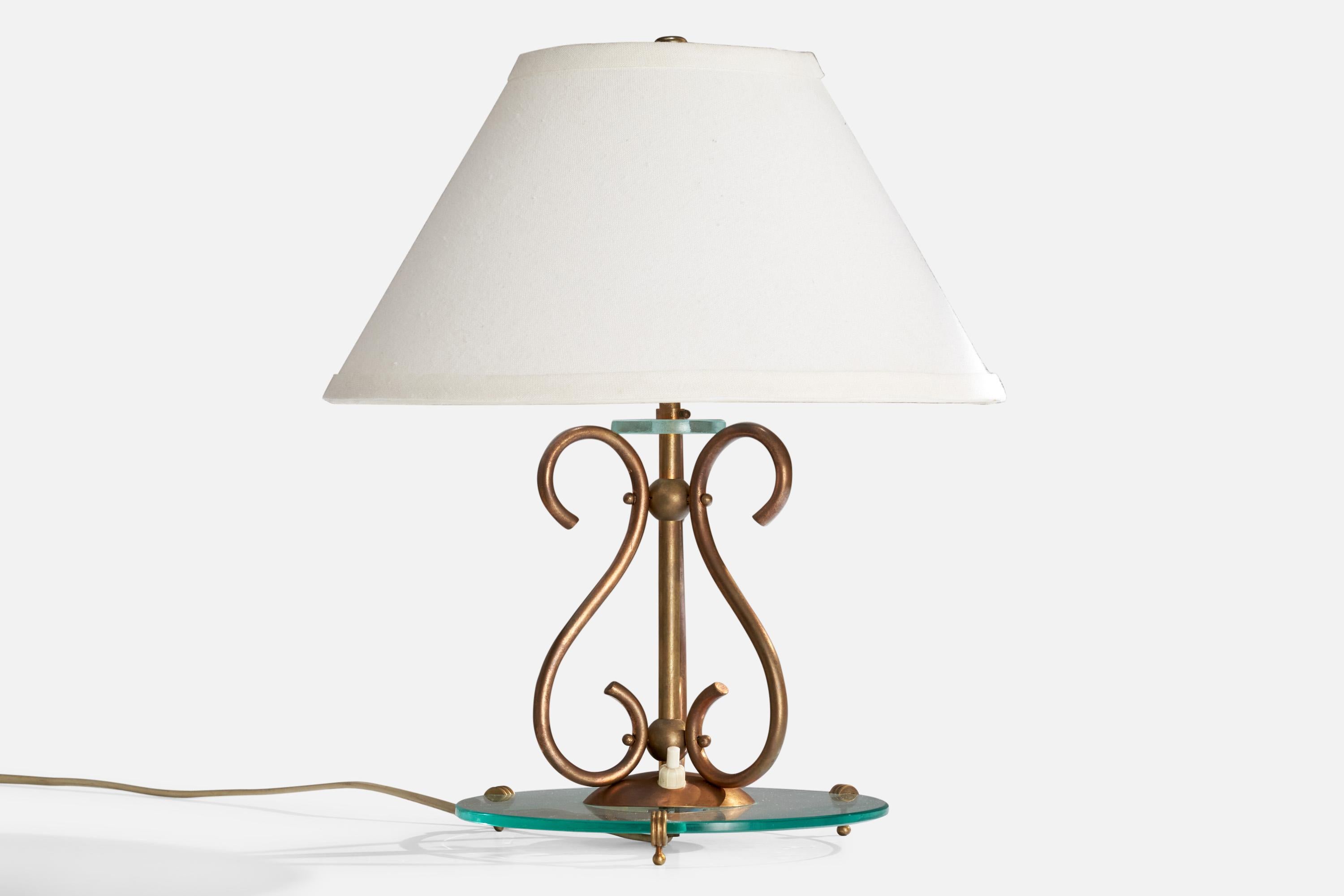 A brass and blue colored glass table lamp designed and produced in Italy, c. 1940s.

Dimensions of Lamp (inches): 10.5“ H x 8.5” DiameterDimensions of Shade (inches): 5” Top Diameter x  12“ Bottom Diameter x 7.25“ H

Dimensions of Lamp with Shade
