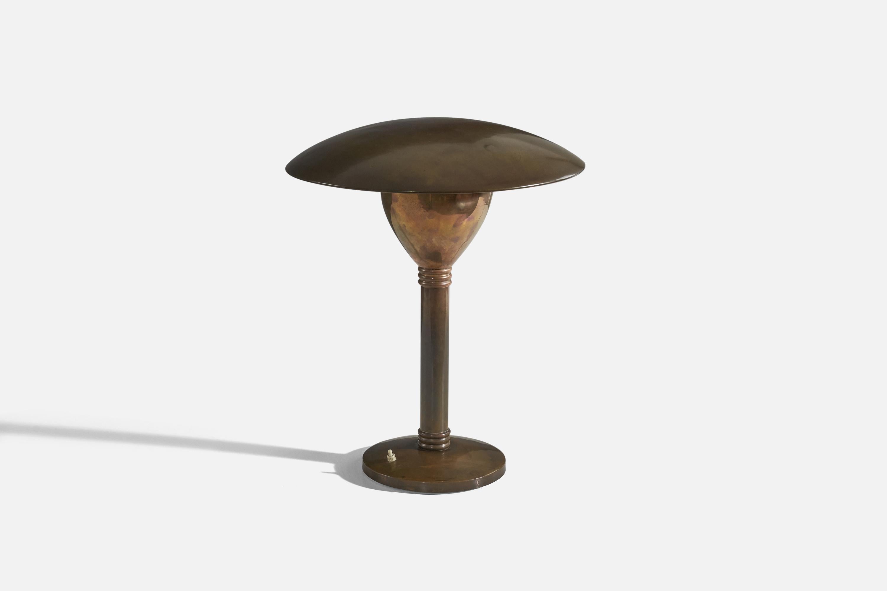 A brass table lamp designed and produced in Italy, 1930s. 

