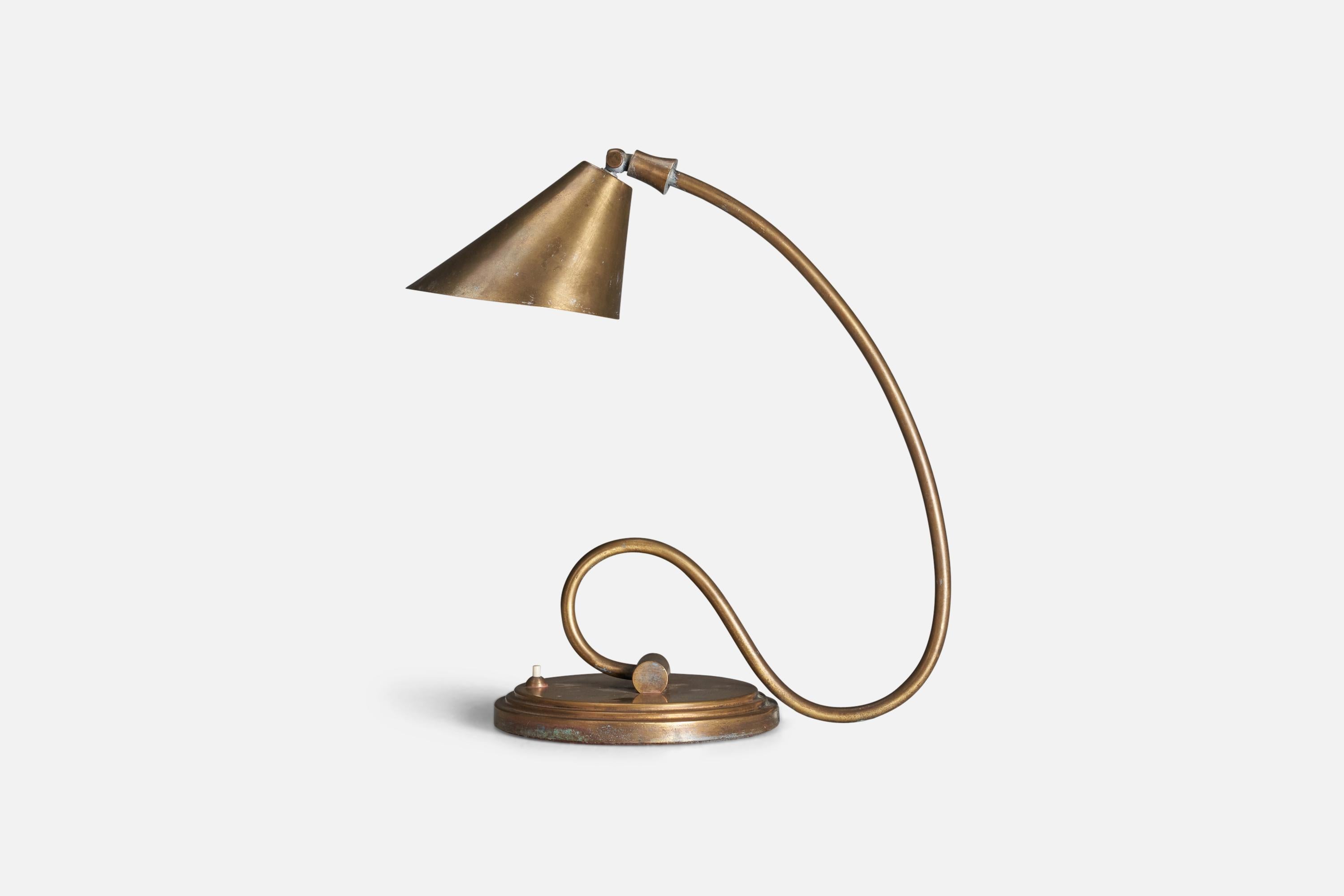A brass table lamp designed and produced by an Italian Designer, Italy, 1930s.

Socket takes E-14 bulb.

There is no maximum wattage stated on the fixture.
