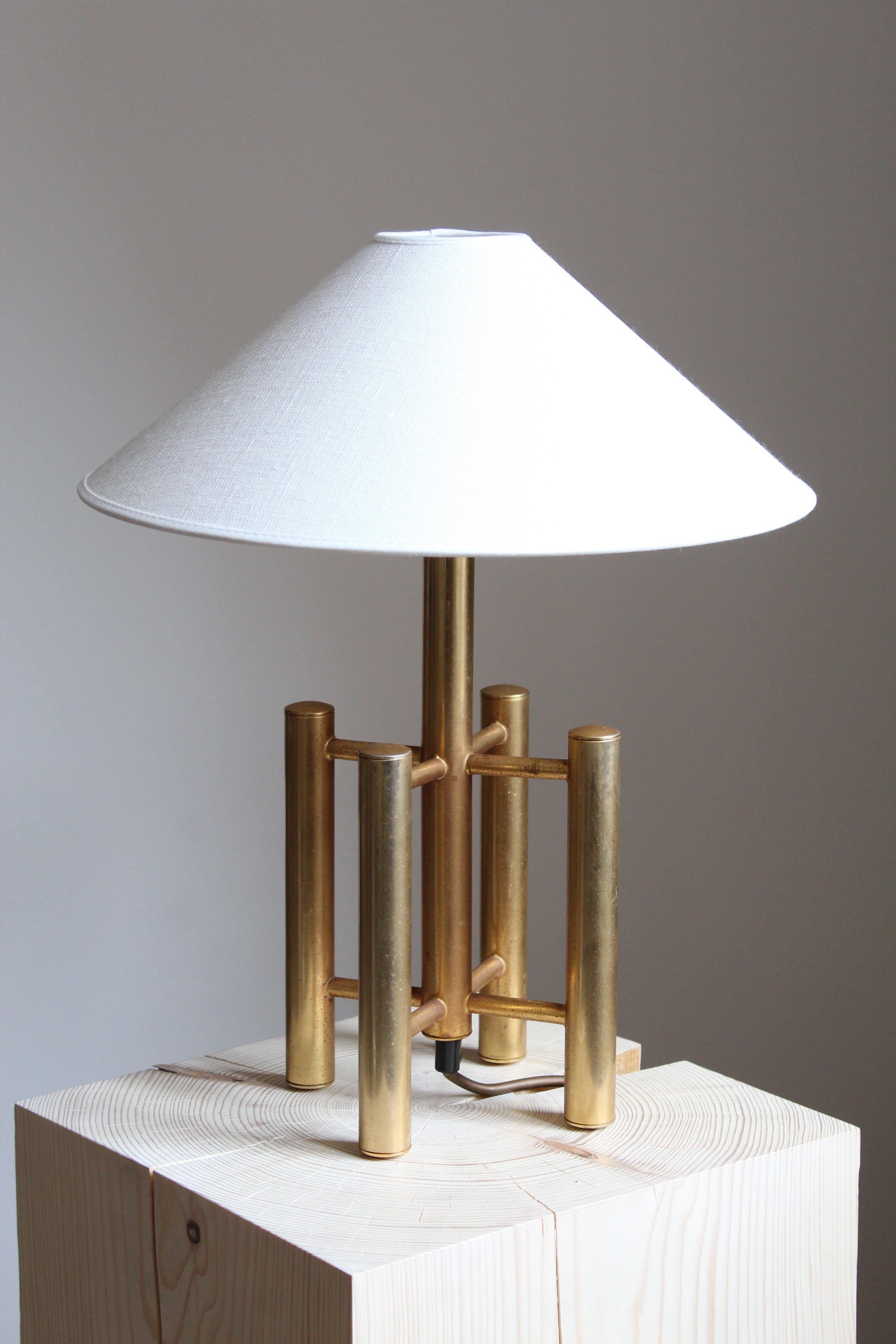 A table lamp. Designed and produced in Italy, 1970s. In brass with metal hardware. 

Sold without lampshade.

Other designers and makers of the period include Gabriella Crespi, Maria Pergay, Max Ingrand, Stilnovo, and Fontana Arte.