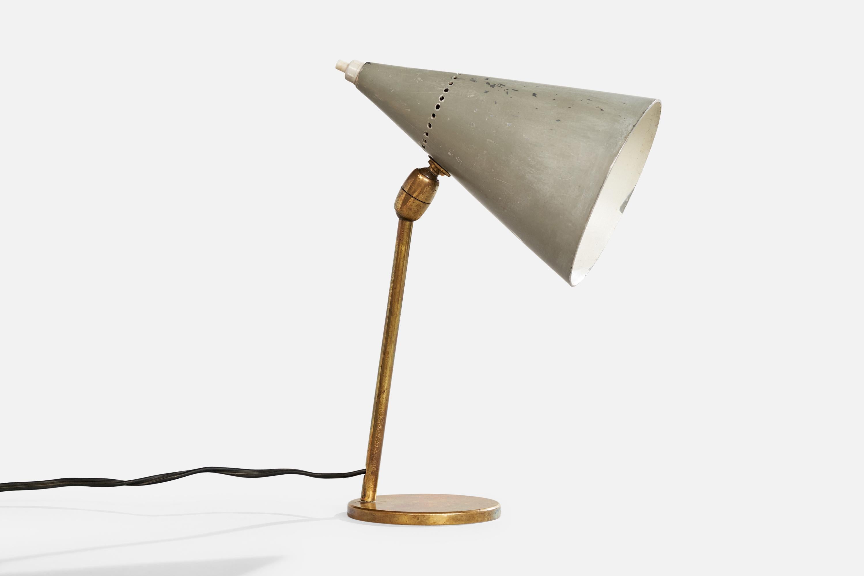 An adjustable brass and grey-lacquered metal table lamp designed and produced in Italy, c. 1950s.

Dimensions of Lamp with Shade (inches): 10.25“ H x 4.125“ W x 6.5” D

Bulb Specifications: E-14

Number of Sockets (per fixture): 1

Sold with