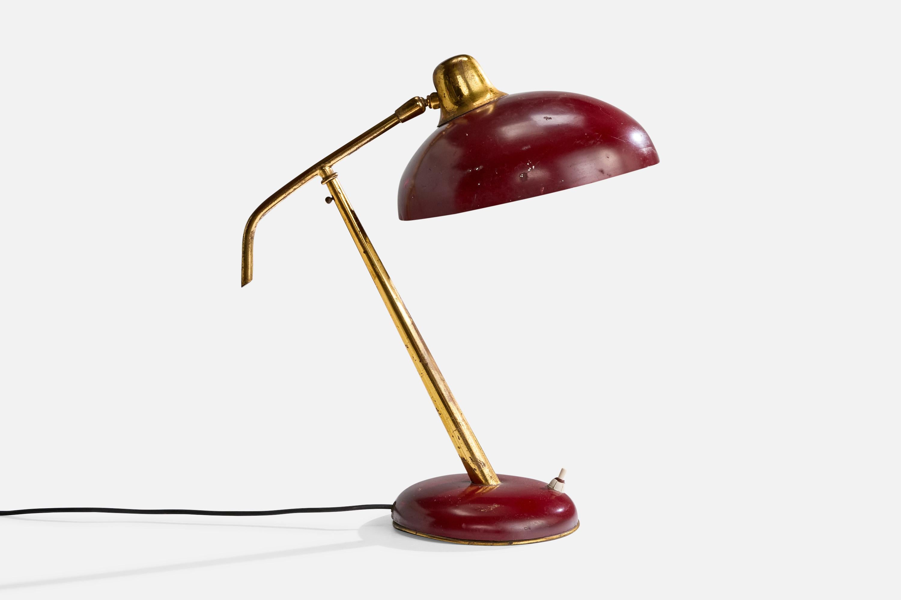 An adjustable brass and red-lacquered metal table lamp designed and produced in Italy, c. 1950s.

Dimensions of Lamp (inches): 15.75