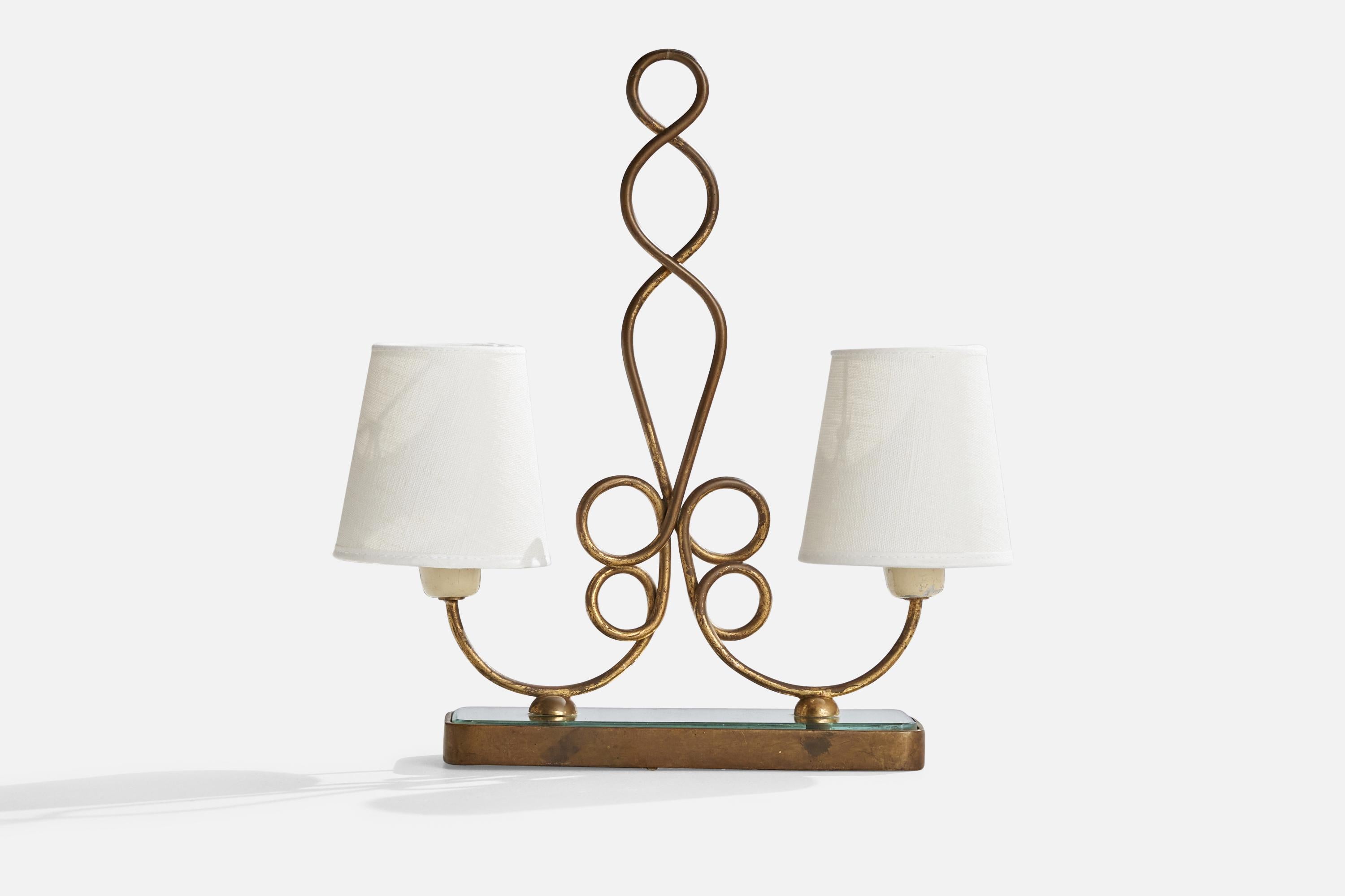 A brass, glass, white lacquered metal and white fabric table lamp designed and produced in Italy, c. 1940s.

Overall Dimensions (inches): 13.5” H x 12.5.5” W x 4.31” D
Stated dimensions include shade.
Bulb Specifications: E-12 Bulb
Number of