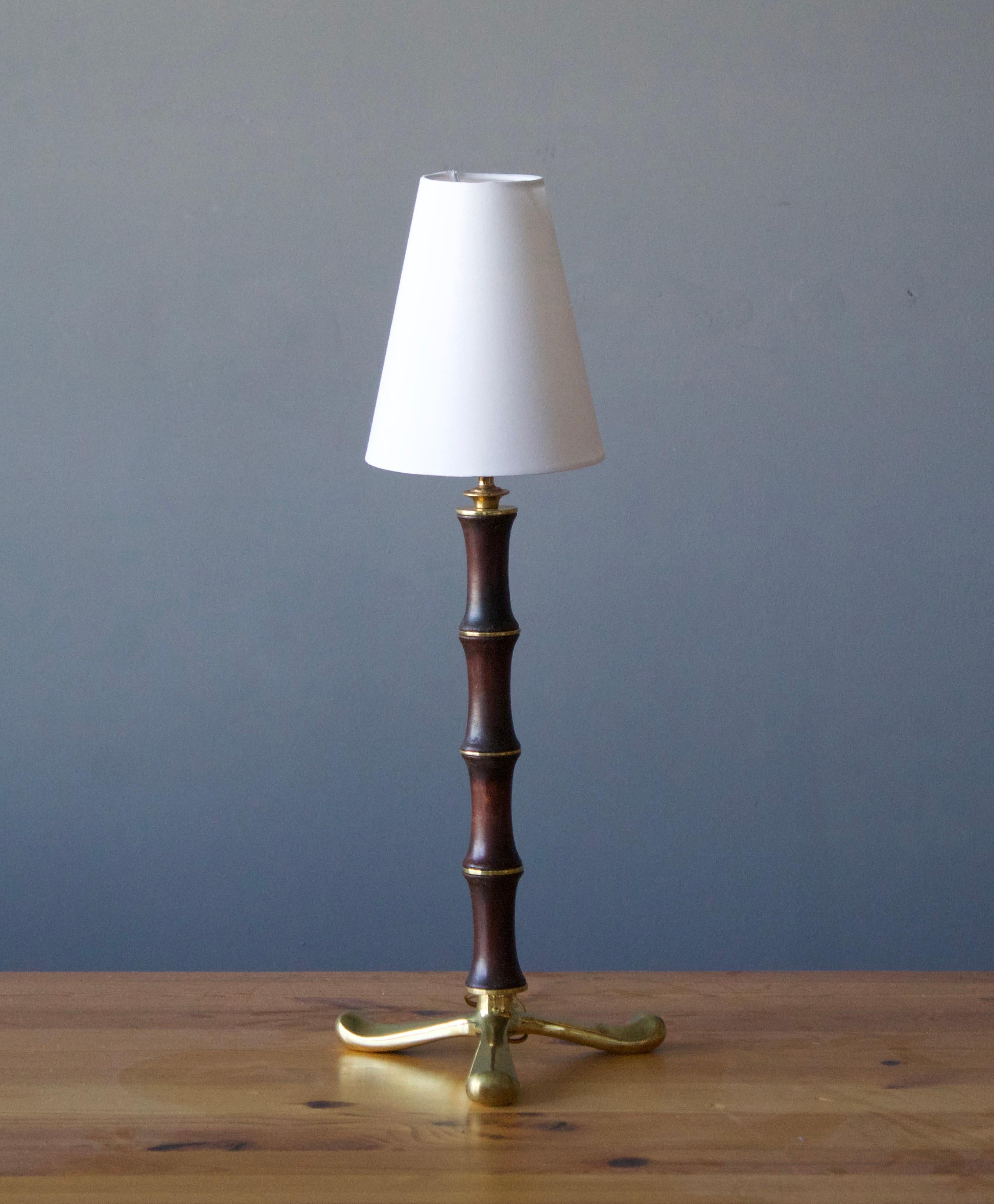 A table lamp on tripod base, designed and produced in Italy, 1940s.

Sold without lampshade. Dimensions excluding lampshade, height includes socket.