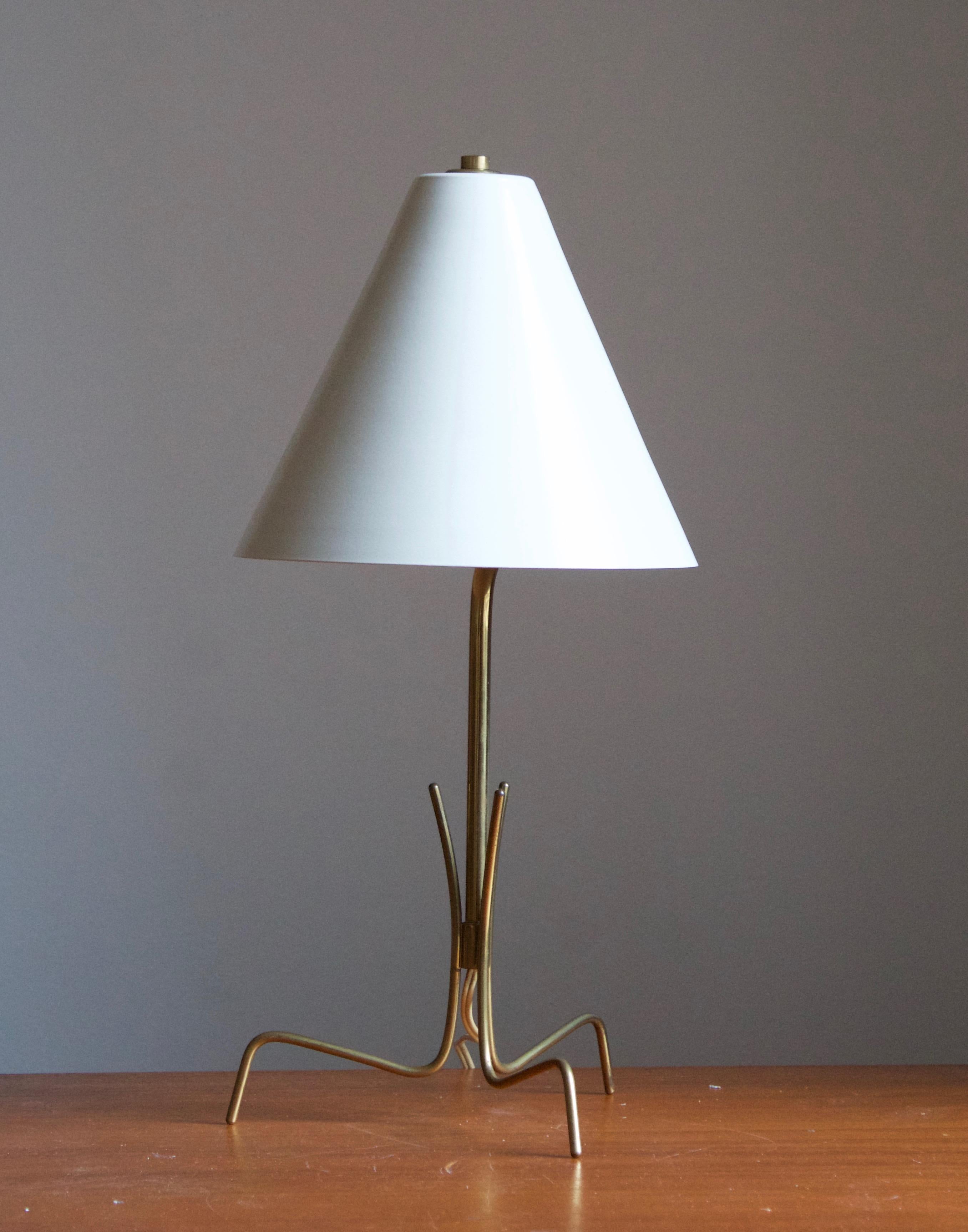 A table lamp / desk light. Designed by an unknown Italian designer. Produced in Italy, 1950s. Features a sculpted brass base, white lacquered metal screen. 

Other Italian lighting designers of the period include Angelo Lelii, Max Ingrand, Gino