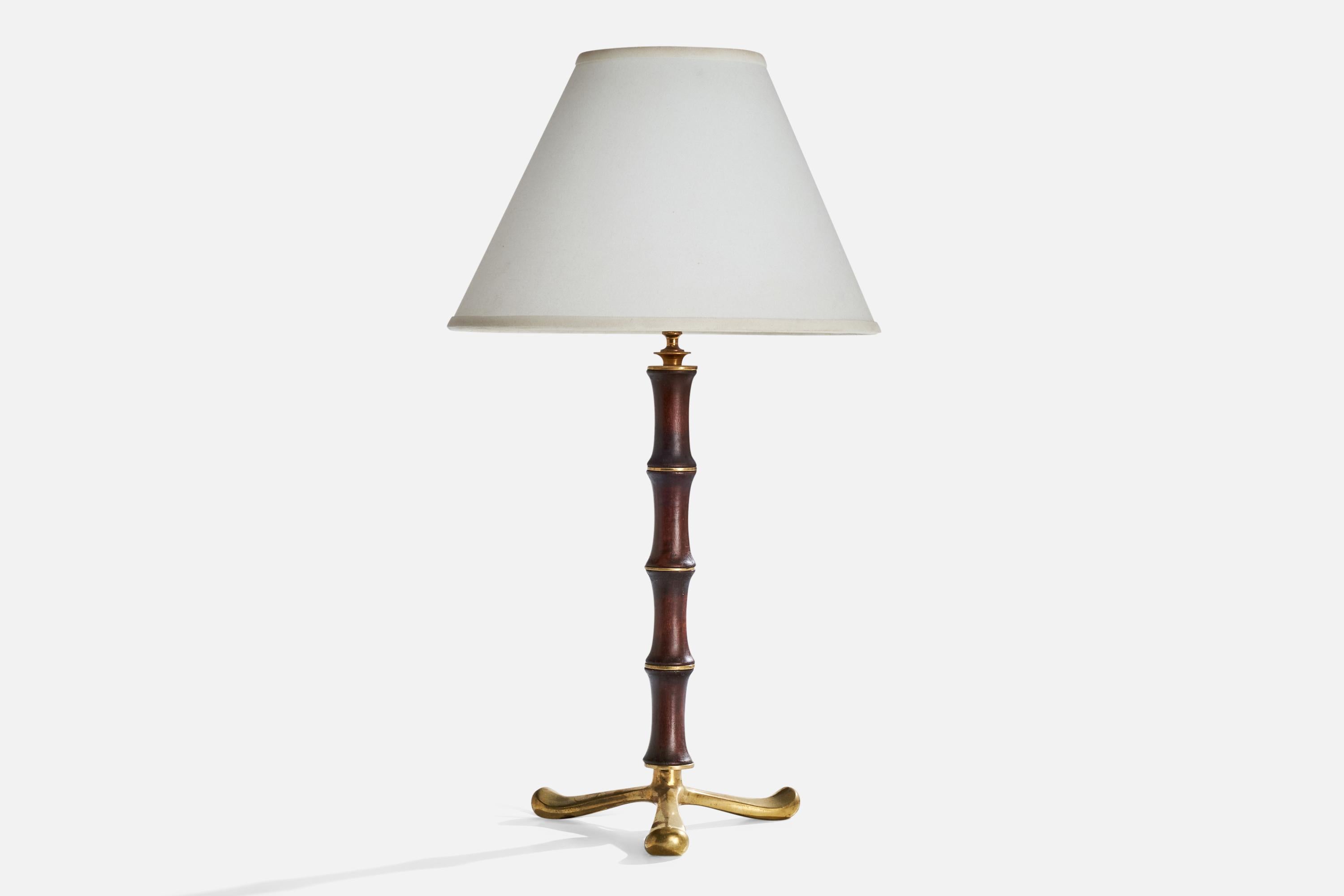 A brass and dark-stained wood table lamp designed and produced in Italy, c. 1930s.

Dimensions of Lamp (inches):  16.25“ H x  8.5” W x  8.5“DDimensions of Shade (inches):  5.25“Top Diameter x  12.25” Bottom Diameter x  8.5“ H

Dimensions of Lamp