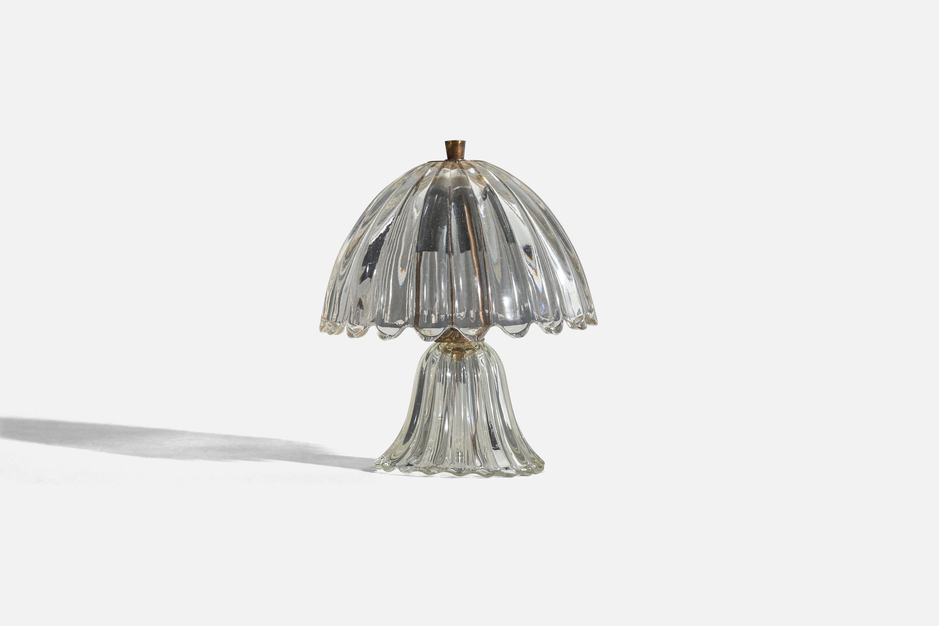 A brass and glass table lamp designed and produced by an Italian designer, Italy, 1950s.

