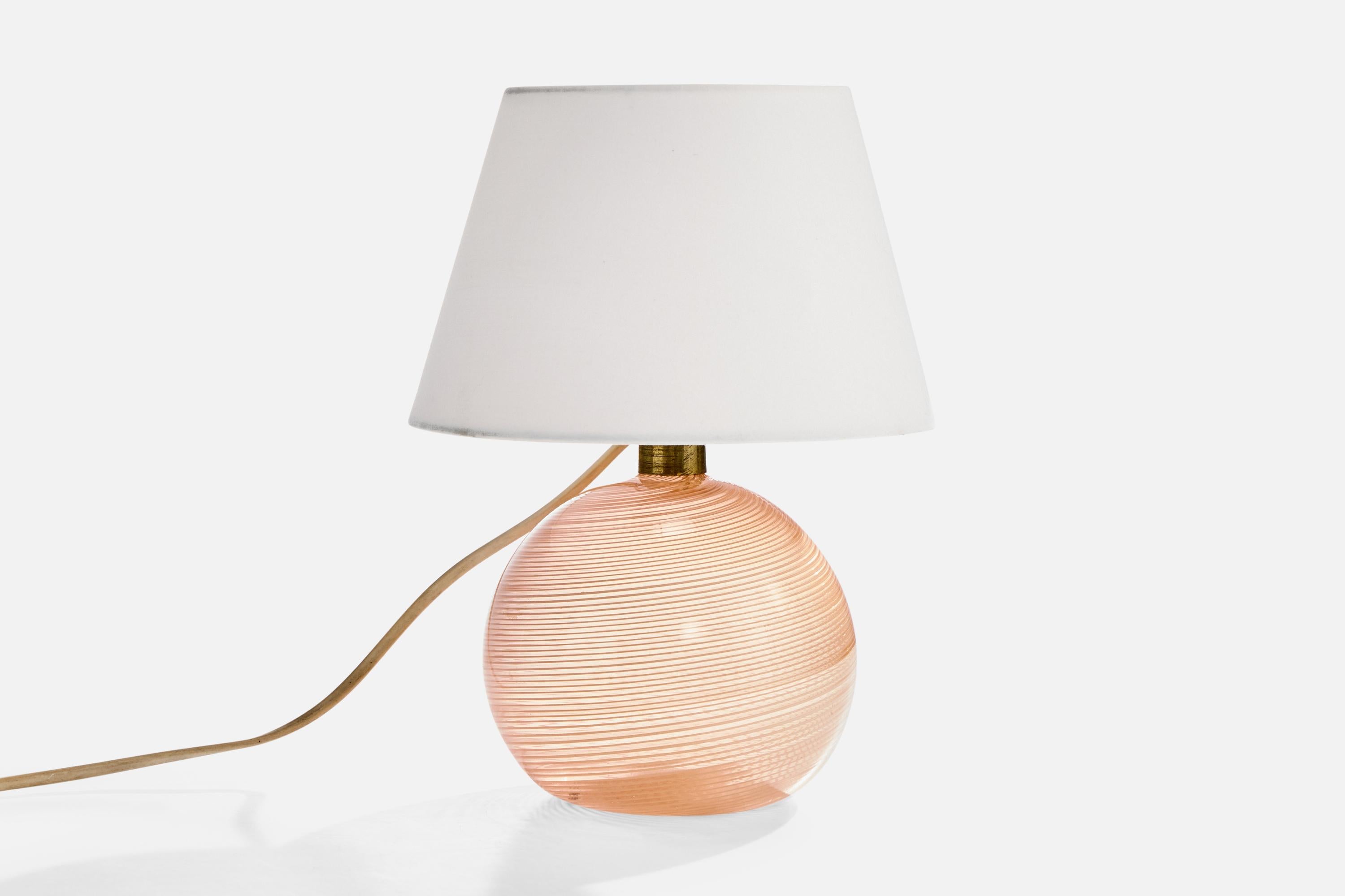 A pink glass and brass table lamp designed and produced in Italy, c. 1970s.

Dimensions of Lamp with Shade (inches): 10.75