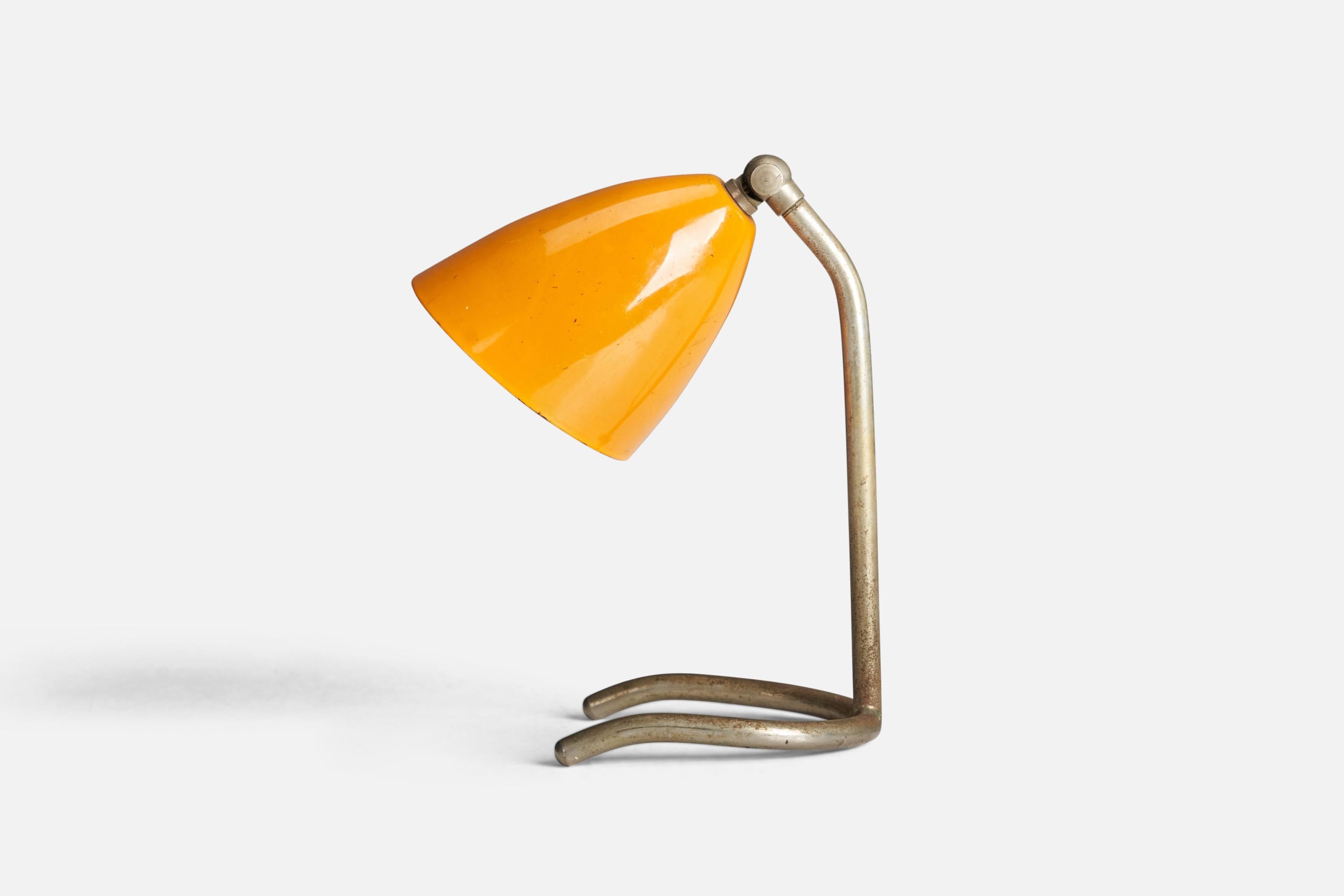 A steel and yellow-lacquered metal table lamp designed and produced by an Italian Designer, Italy, 1950s.

Socket takes E-14 bulb.

There is no maximum wattage stated on the fixture.
