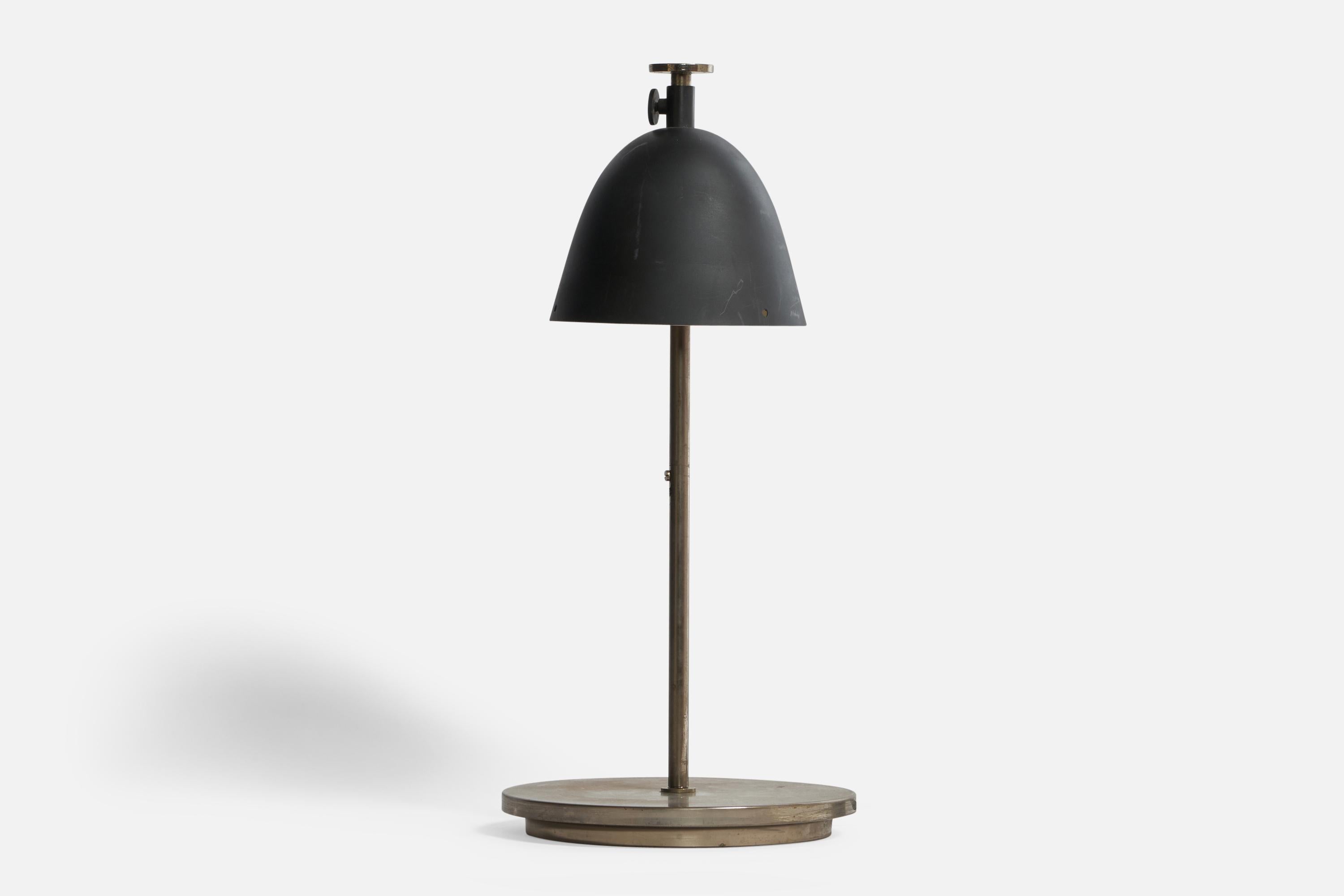 An adjustable black-lacquered metal and steel table lamp designed and produced in Italy, 1950s.

Overall Dimensions (inches): 19” H x 8.75” Diameter
Bulb Specifications: E-14 Bulb
Number of Sockets: 1
All lighting will be converted for US usage. We