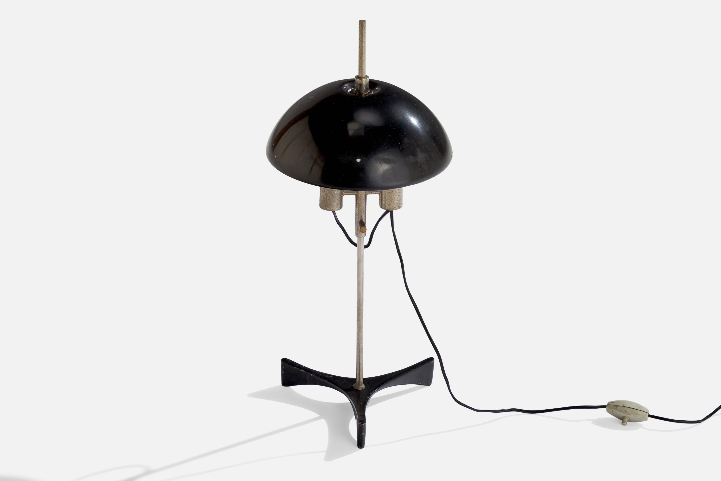 A steel and black-lacquered metal table lamp designed and produced in Italy, 1950s.

Overall Dimensions (inches): 19 “ H x 7.75 “ Diameter 
Bulb Specifications: E-14 Bulb
Number of Sockets: 2
All lighting will be converted for US usage. We is unable