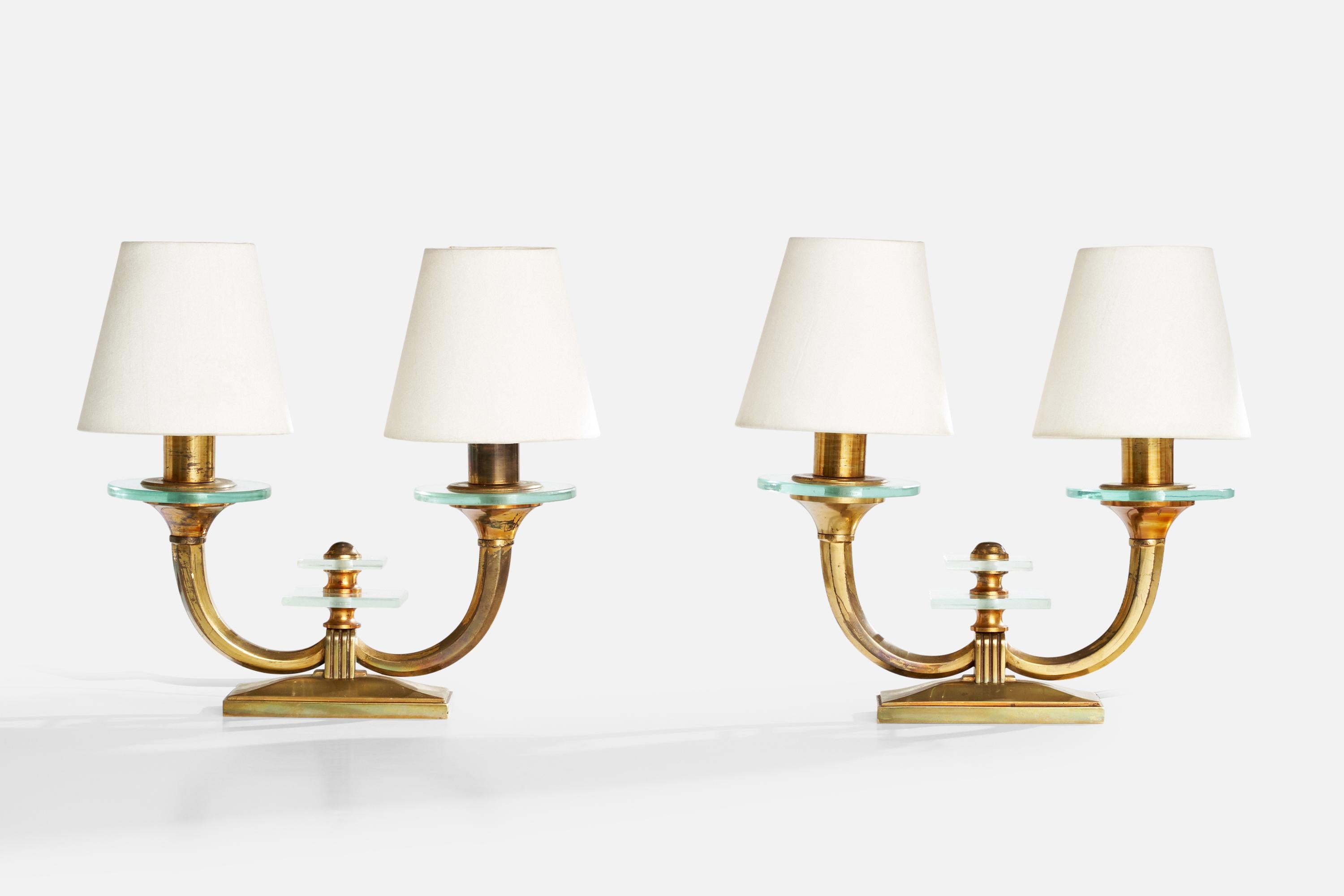 A pair of brass, glass and white fabric table lamps designed and produced in Italy, c. 1940s.

Dimensions of Lamp with Shade (inches): 11.2“ H x 12” W x 5.1” D

Bulb Specifications: Bayonet 15D Base

Number of Sockets (per fixture): 2

Sold with
