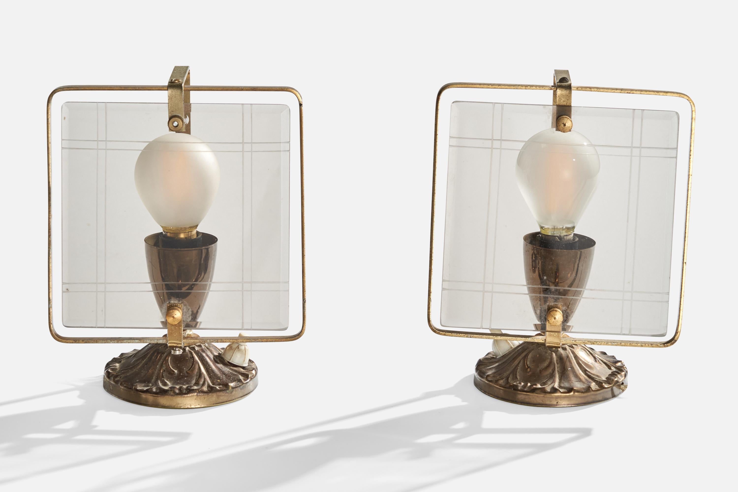 A pair of brass and glass table lamps designed and produced in Italy, c. 1940s.

Dimensions of Lamp with Shade (inches): 6.75” H x 5.125” Diameter

Bulb Specifications: E-12 Bulbs

Number of Sockets (per fixture): 1

Sold with lampshade.

All