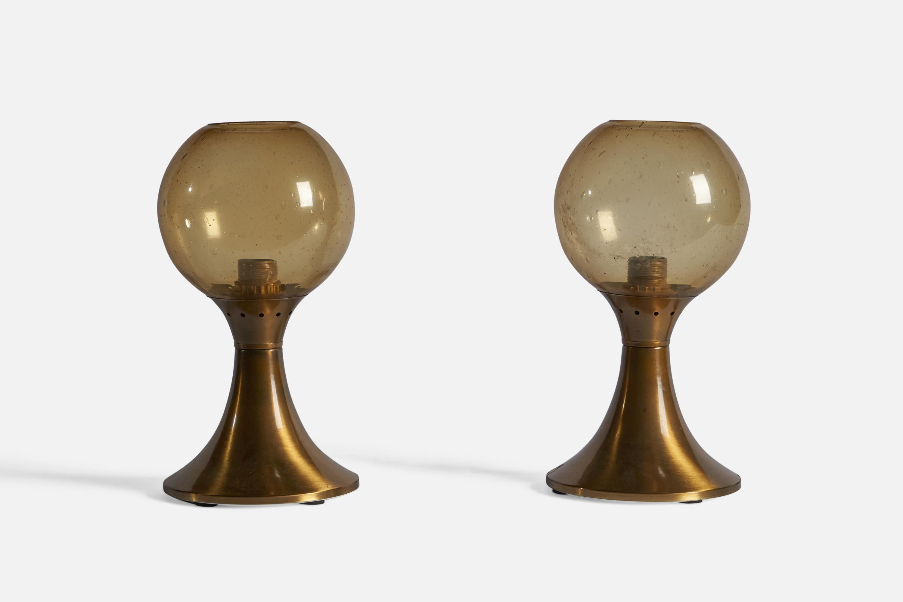 A pair of brass and yellow glass table lamps, designed and produced in Italy, 1970s.

Overall Dimensions: 14.75