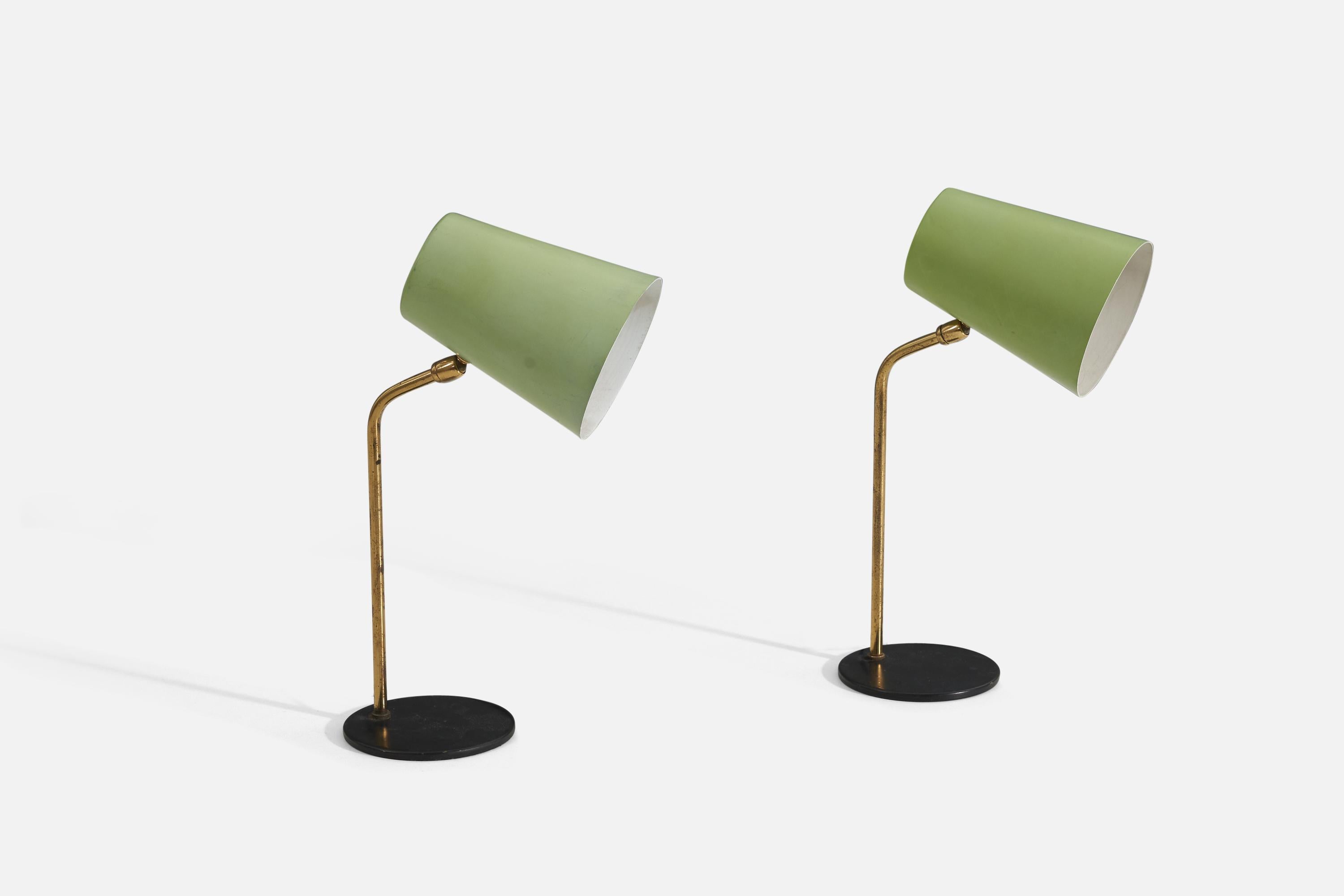 A pair of adjustable table lamp designed and produced in Italy 1950s In brass, with black bases and green-lacquered metal shades.