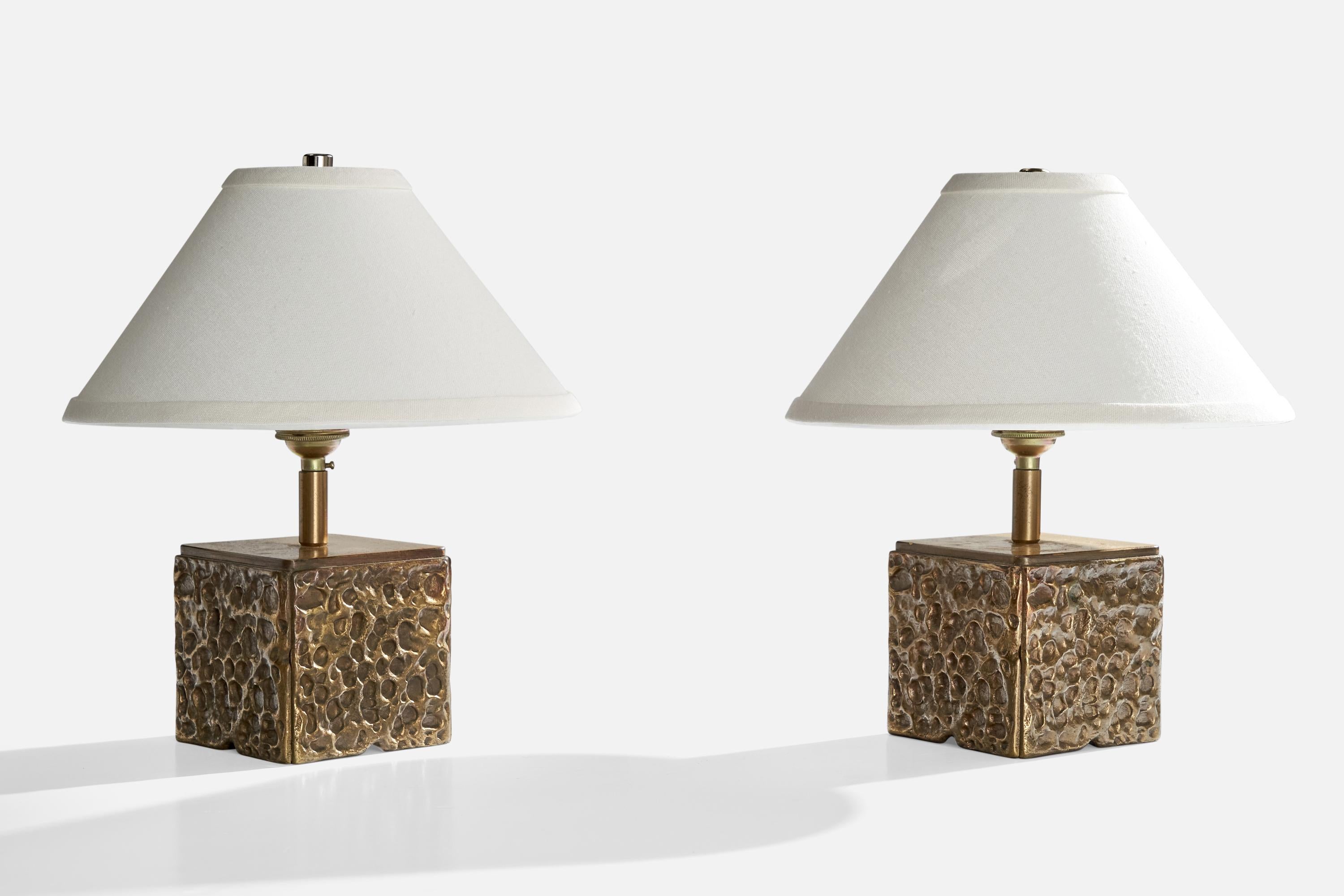 A pair of brass table lamp designed and produced in Italy, c. 1970s.

Dimensions of Lamp (inches): 7” H x 4.25” W x 4.25” D

Dimensions of Shade (inches): 3.125” Top Diameter x 10.25” Bottom Diameter x 6.125” H

Dimensions of Lamp with Shade