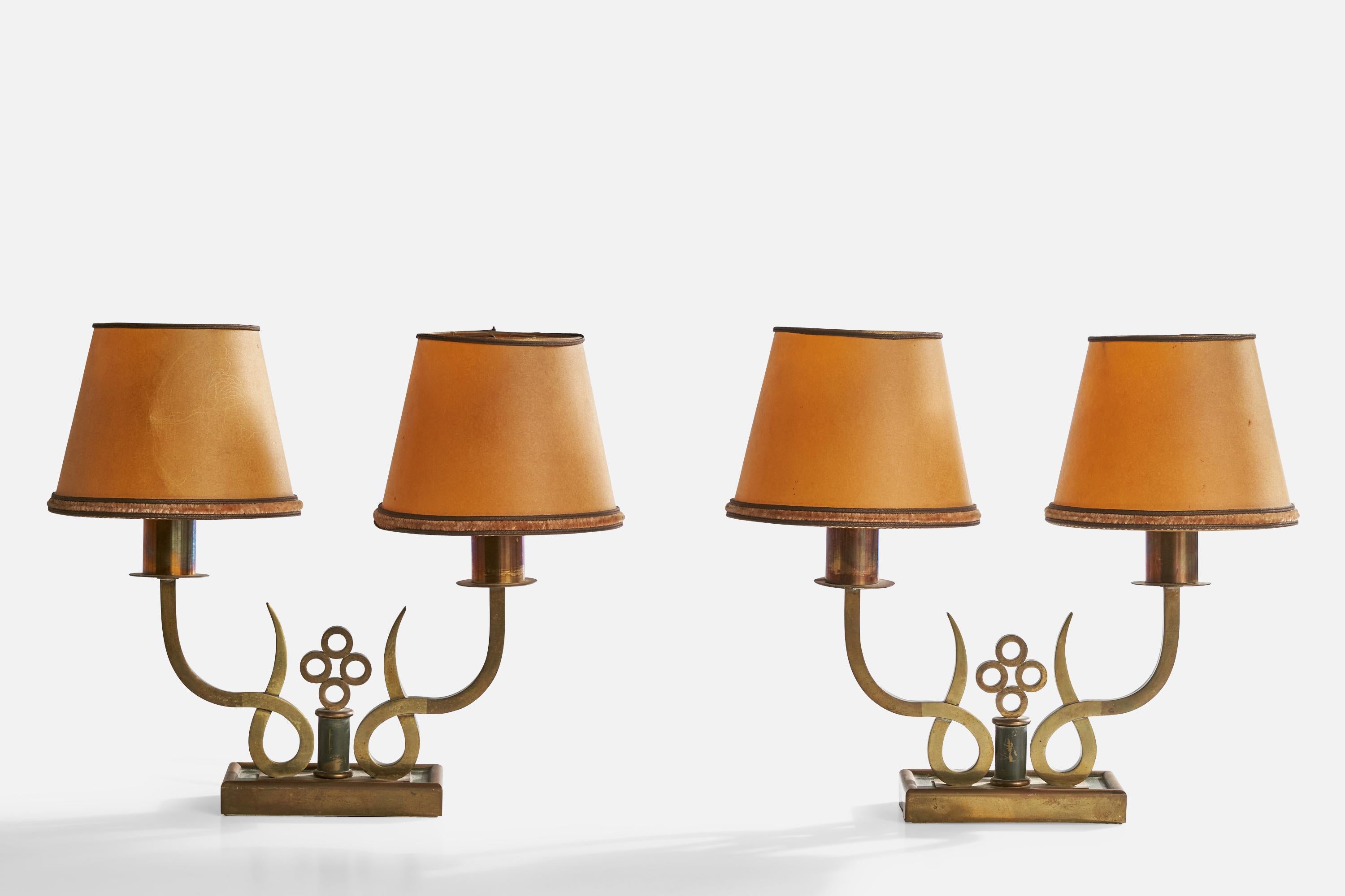 A pair of brass, green-lacquered metal and brown parchment paper table lamps designed and produced in Italy, c. 1930s.

Dimensions of Lamp with Shade (inches): 11.75” H x 14” W x 6.125“ D

Bulb Specifications: Bayonet

Number of Sockets (per