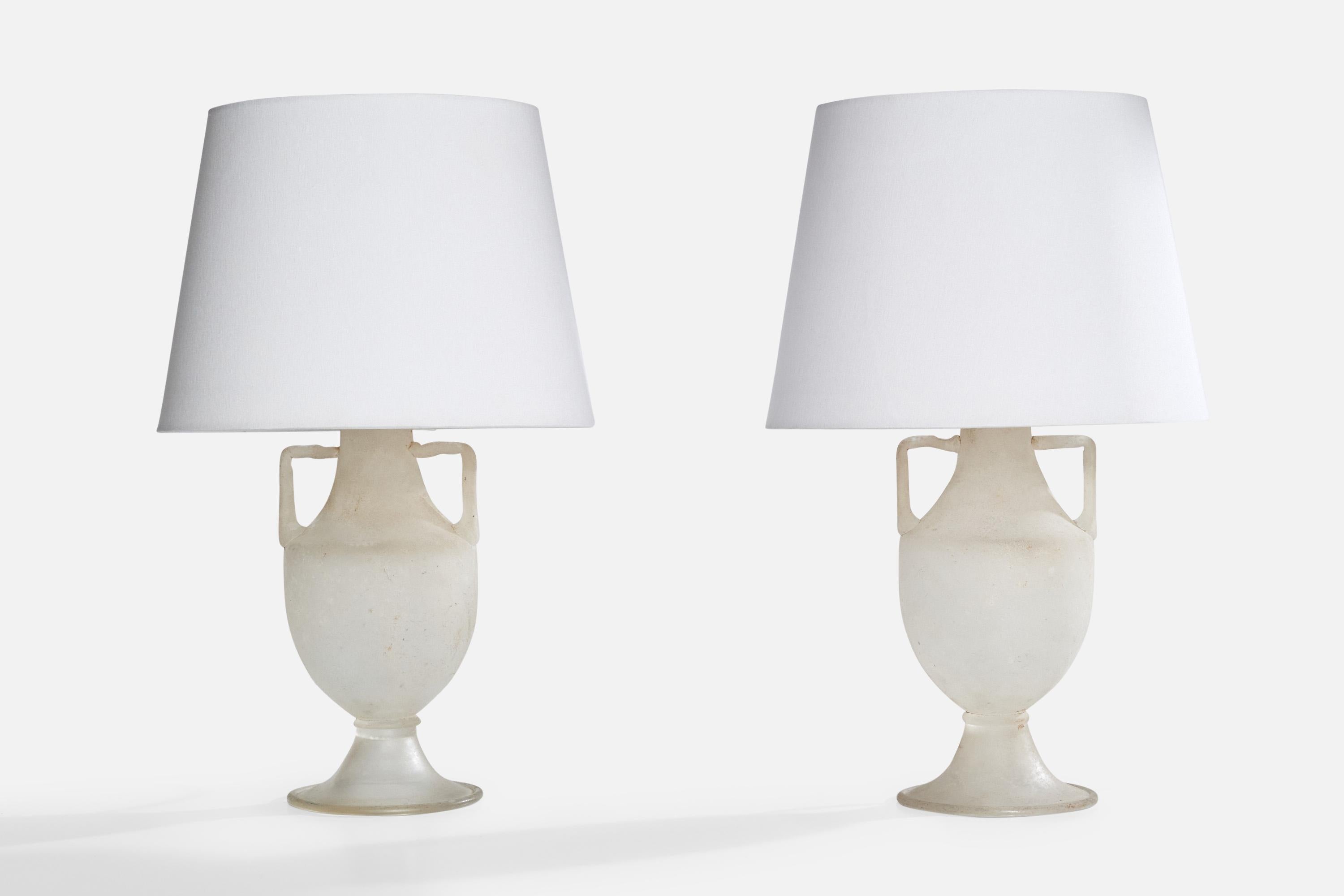 A pair of milk glass and brass table lamps designed and produced in Italy, c. 1940s.

Dimensions of Lamp (inches): 14“ H x 5.5” Diameter

Dimensions of Shade (inches): 9” Top Diameter x 12” Bottom Diameter x 9“ H

Dimensions of Lamp with Shade