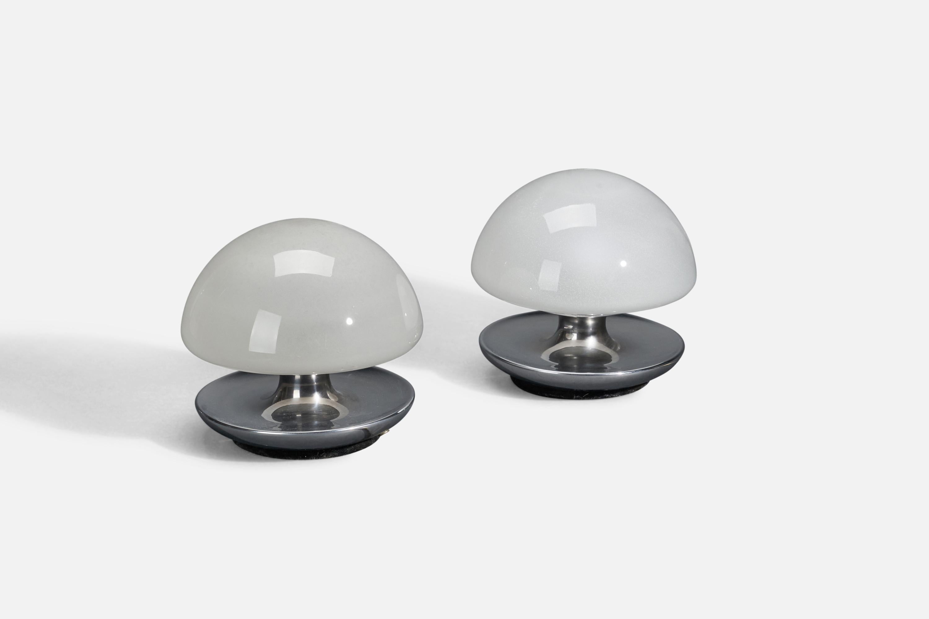 A pair of smoked glass & stainless steel table lamps designed and produced in Italy, 1970s.
