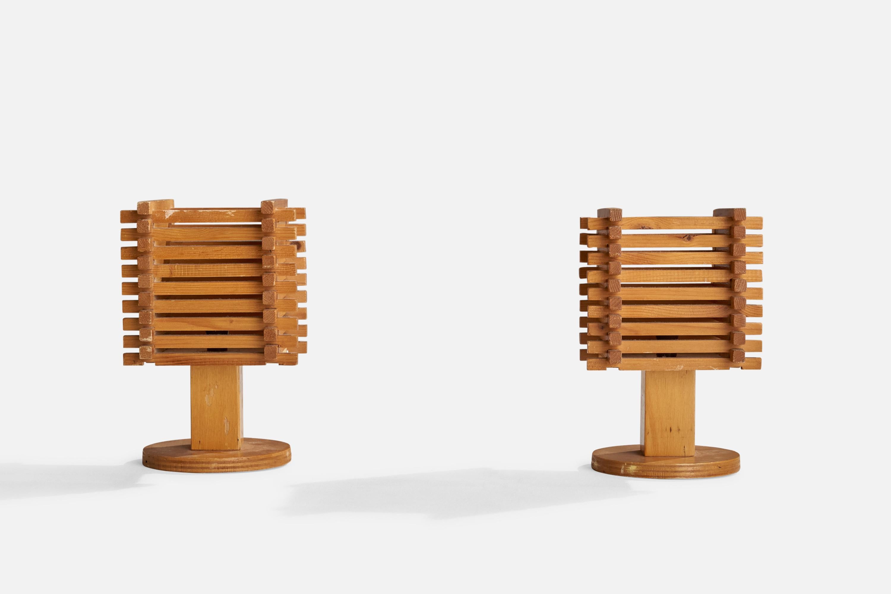 A pair of wood table lamps designed and produced in Italy, c. 1960s.

Overall Dimensions (inches): 11” H x 7” W x 6.5” D
Stated dimensions include shade.
Bulb Specifications: E-14 Bulb
Number of Sockets: 2
All lighting will be converted for US