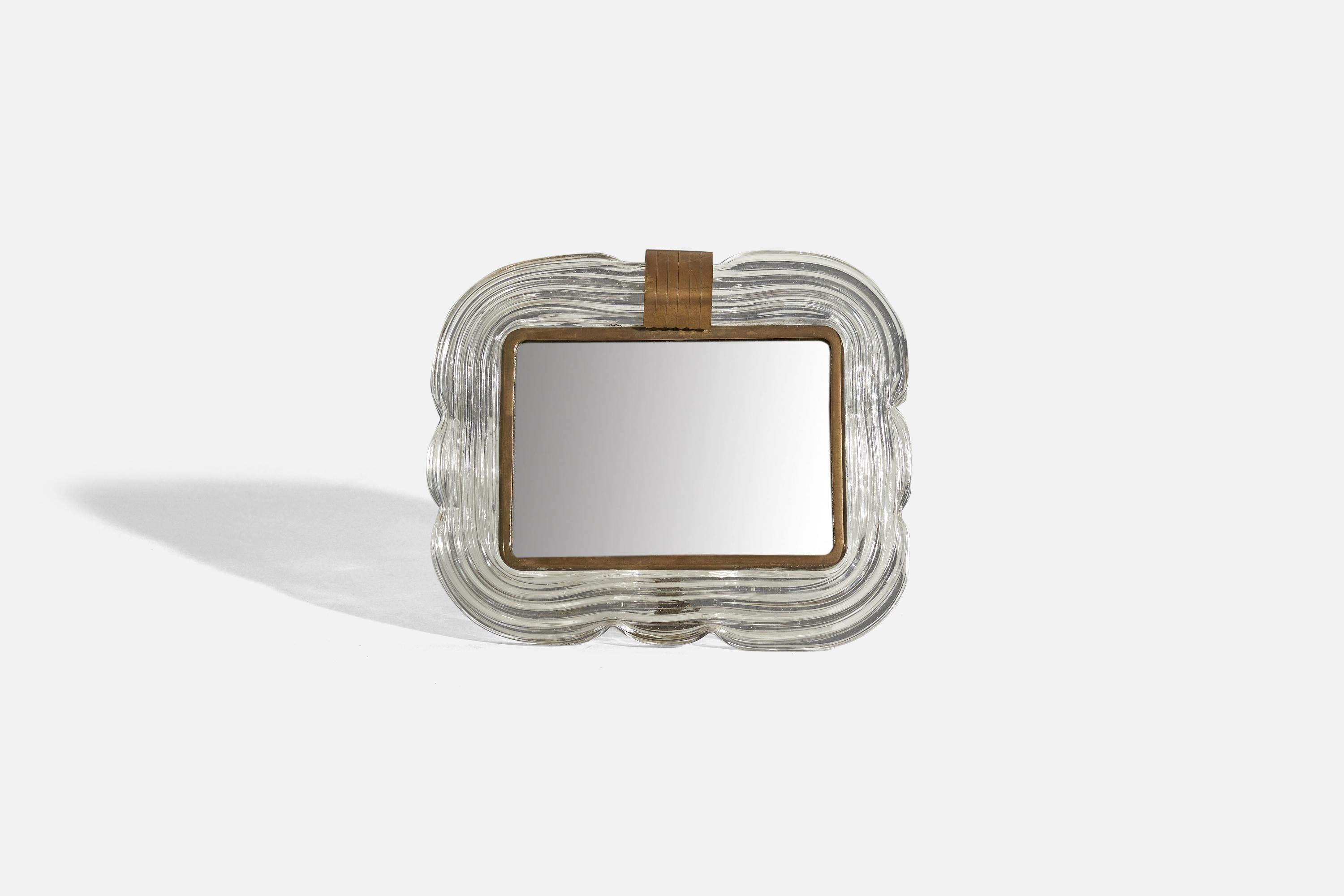 A brass and glass table mirror, designed and produced in Italy, 1940s.