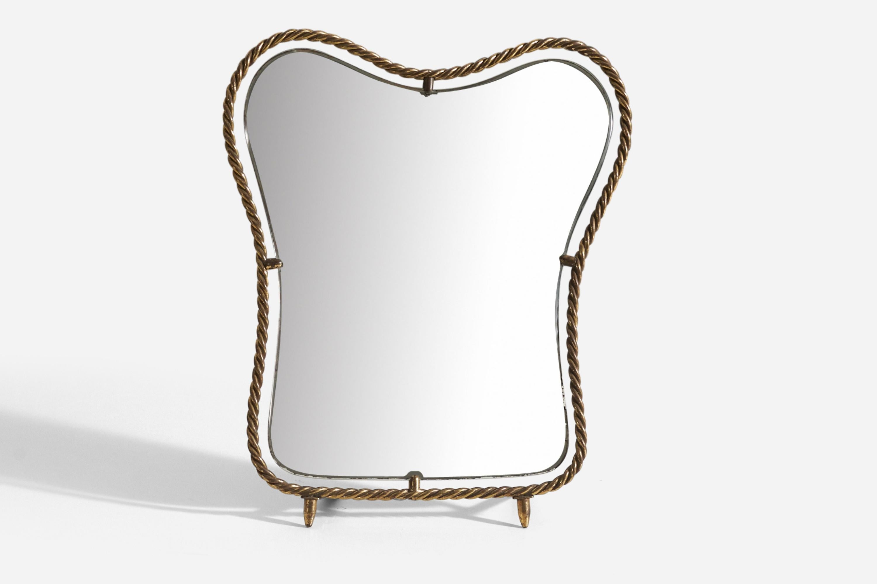 A table mirror framed in detailed brass, produced in Italy, 1940s.
