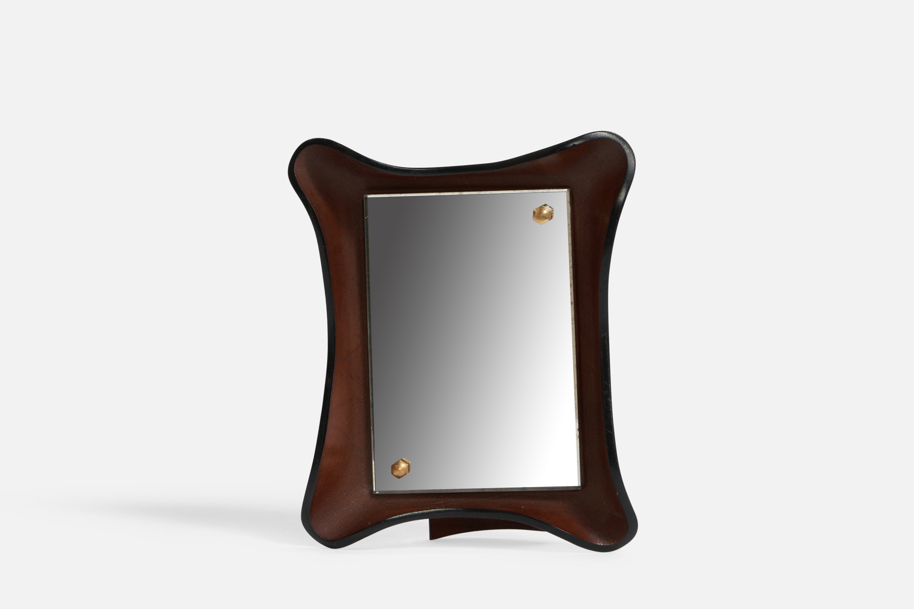 A wet-moulded leather and brass table mirror designed and produced in Italy, c. 1960s.