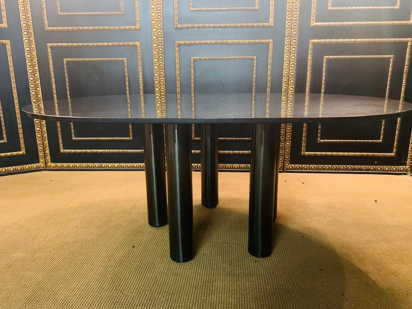 Conference table or dining table with high quality Star Galaxy granite plate oval.
 stands on 5 steel columns.
ideal for the office or at home as a dining table.
some scratches on the plate
Signed Zanotta Italy new price 8900€