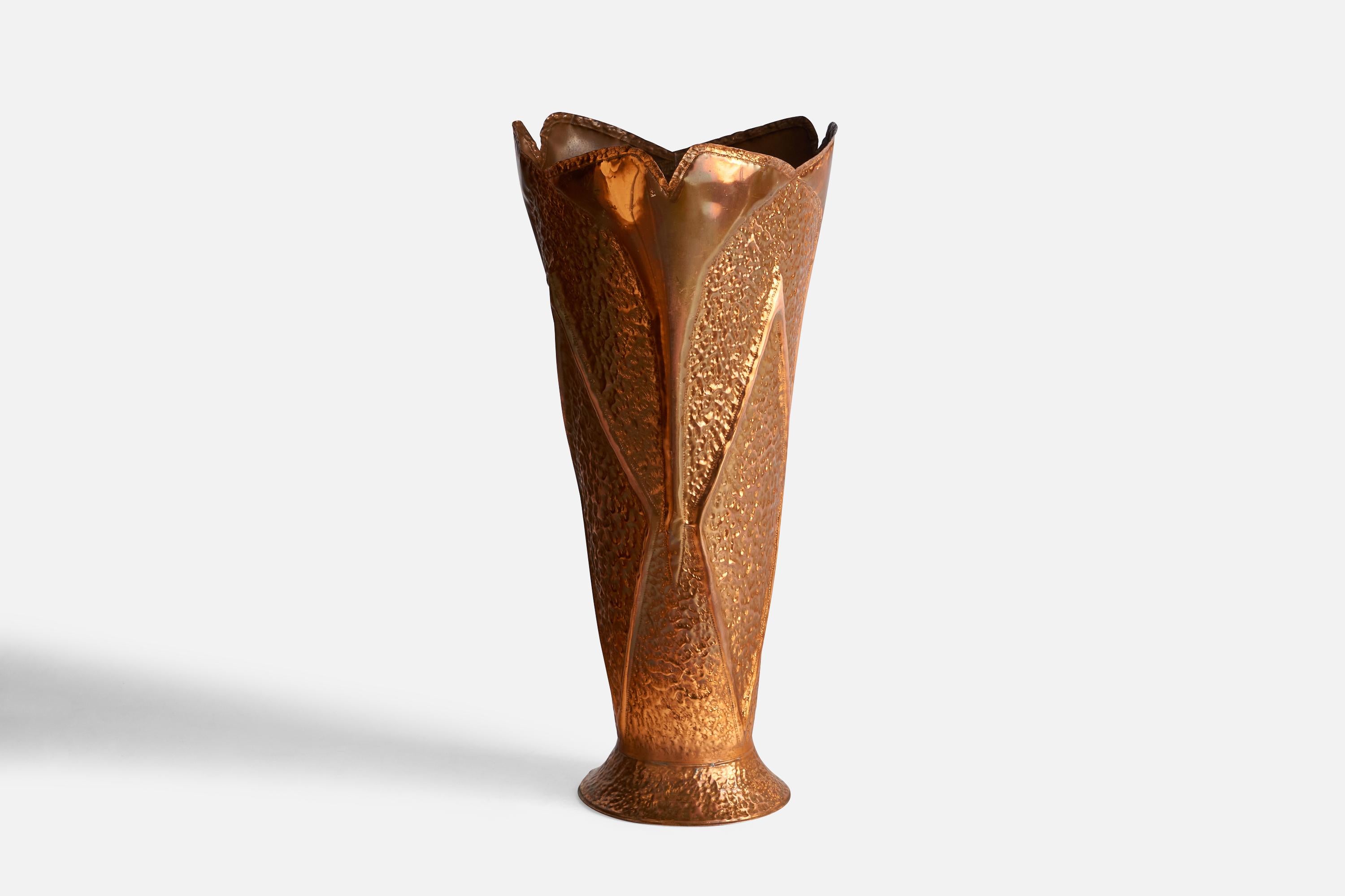 A hammered copper umbrella stand designed and produced in Italy, c. 1960s.