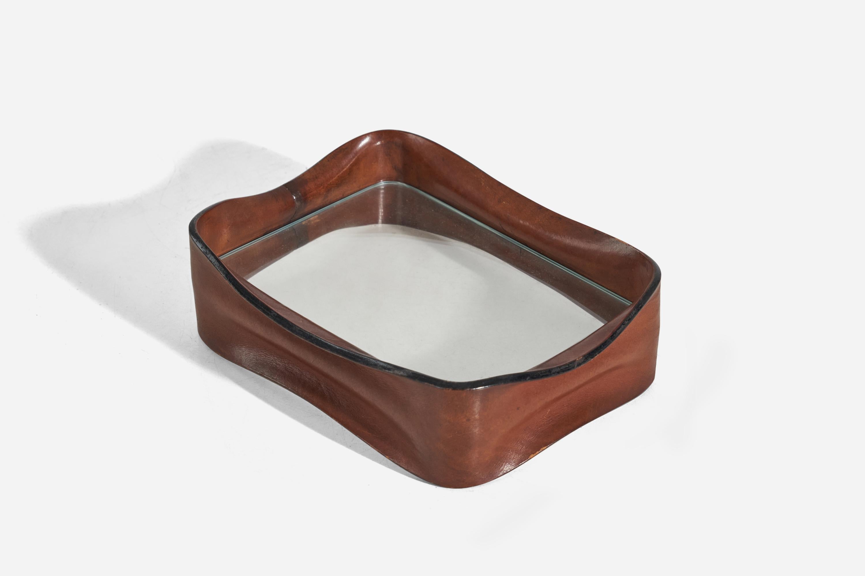 A wet-moulded leather and glass vide-poche or tray designed and produced in Italy, c. 1940s.

