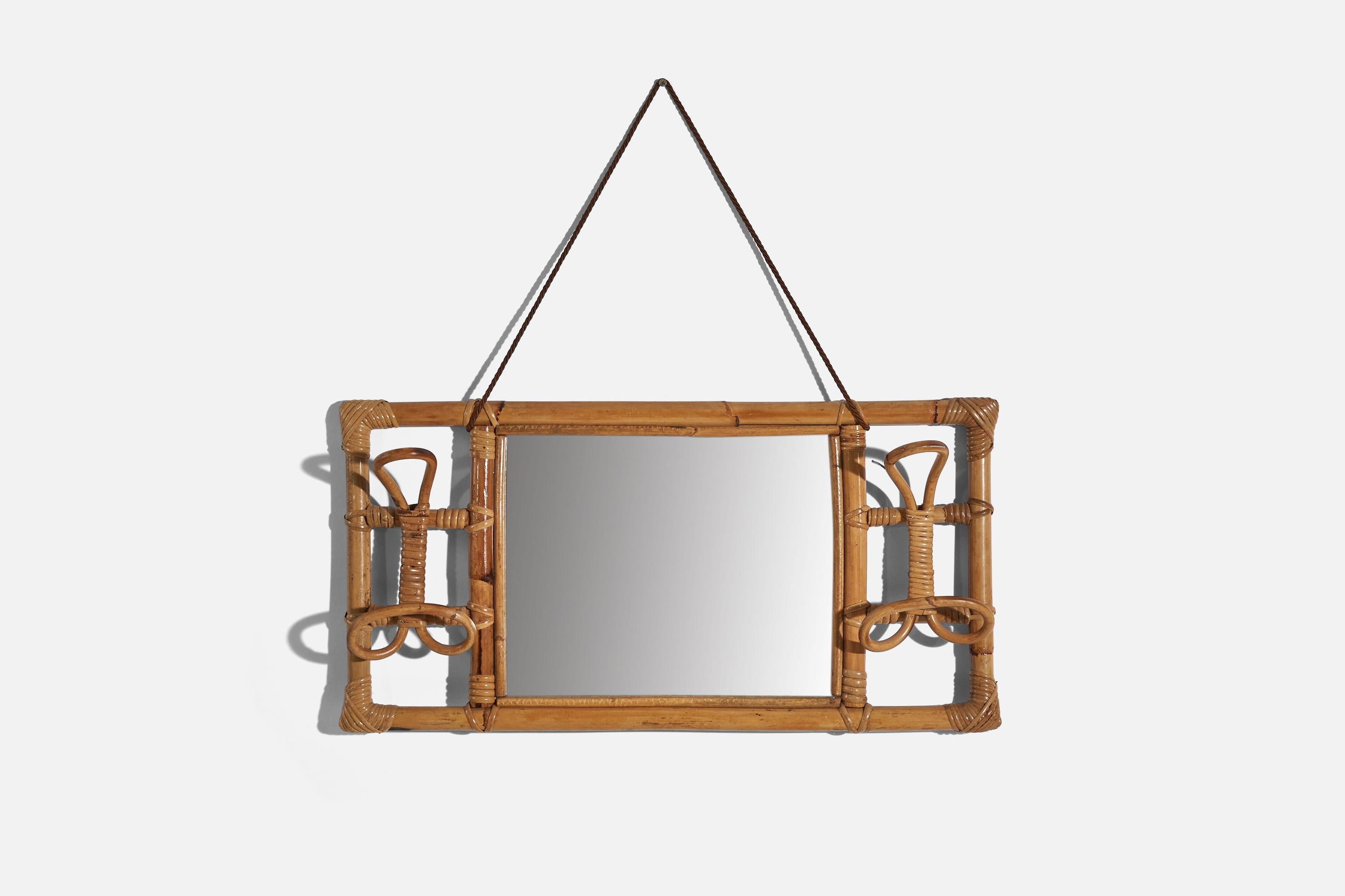 A bamboo and rattan wall coat hanger with mirror, designed and produced by an Italian designer, Italy, 1950s-1960s.
 