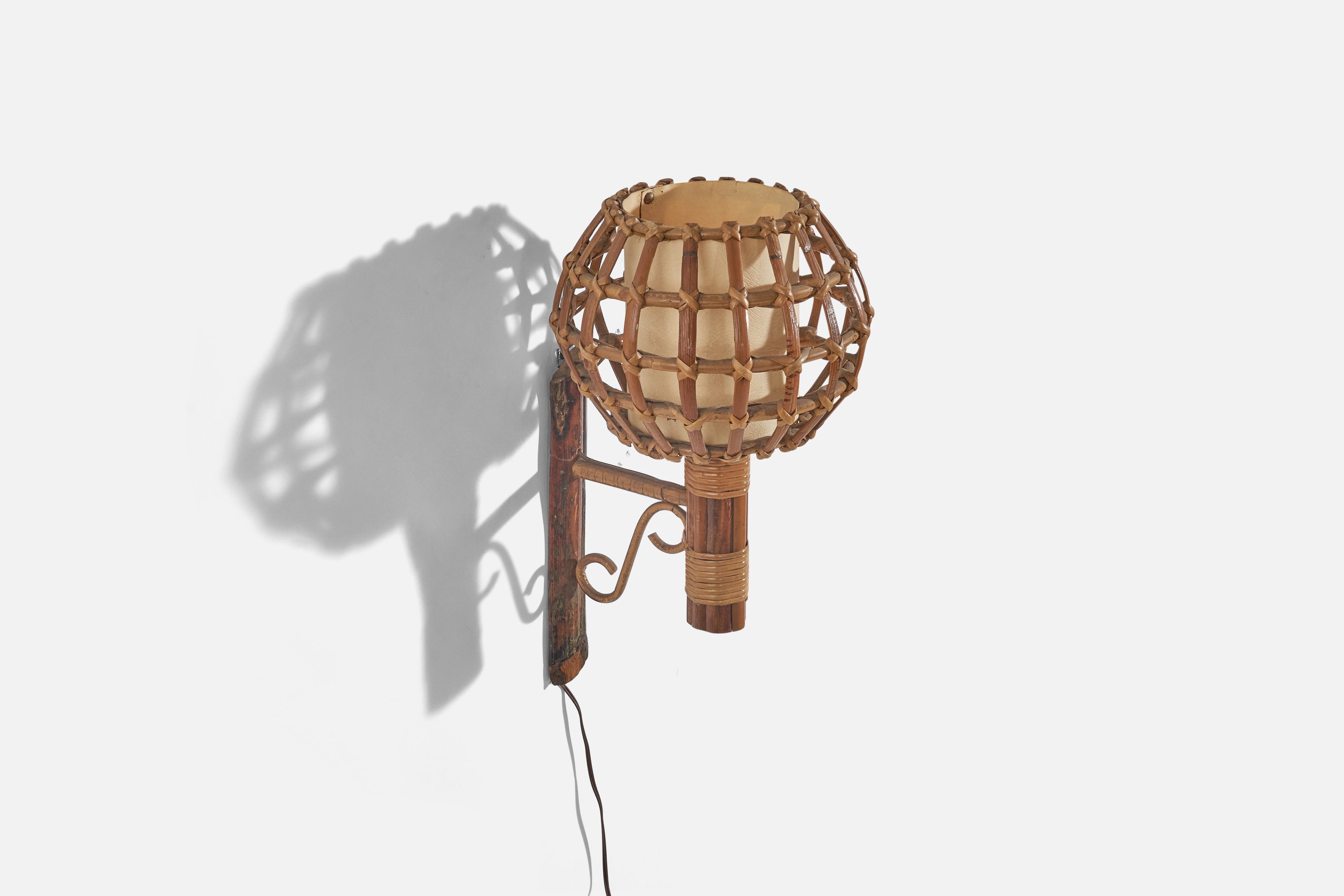 A bamboo and rattan wall light designed and produced by an Italian designer, Italy, 1970s.