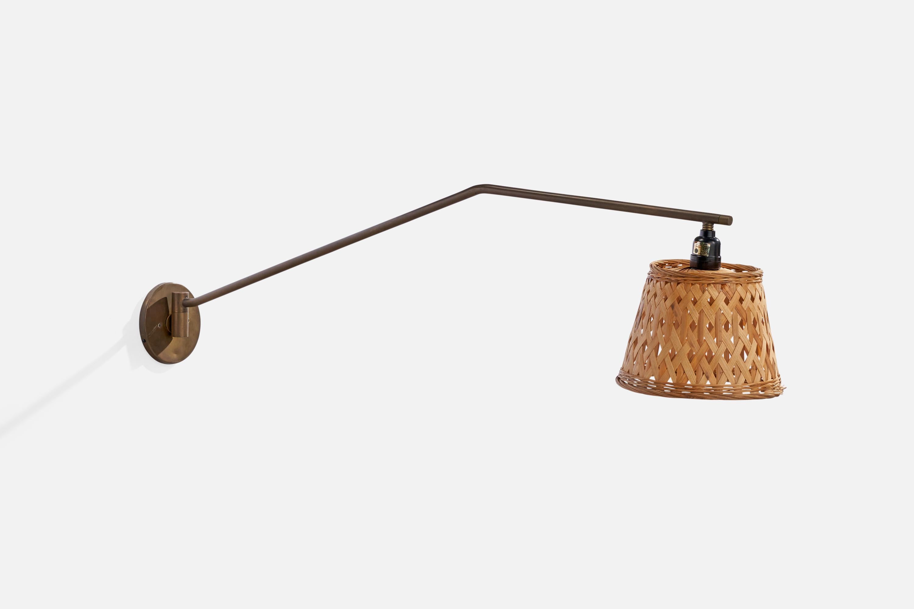 A brass and rattan wall light designed and produced in Italy, 1940s.

Overall Dimensions (inches): 10.50” H x 7.75”  W x 39.75” D
Back Plate Dimensions (inches): 4.75”  H x 4.75” W x .50” D
Bulb Specifications: E-26 Bulb
Number of Sockets: 1
All