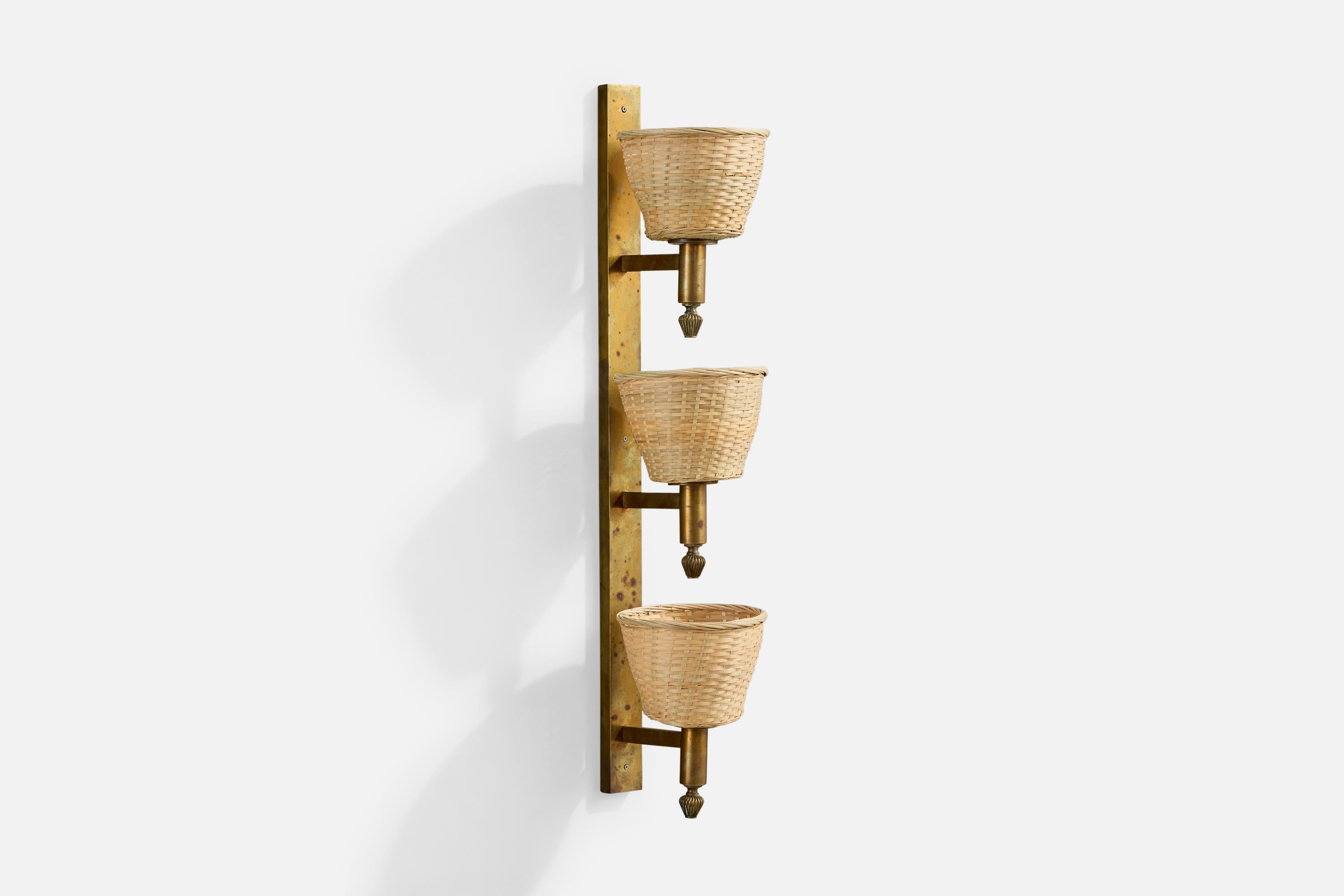 A brass and rattan wall light designed and produced in Italy, 1940s.

Overall Dimensions (Inches): 34.0