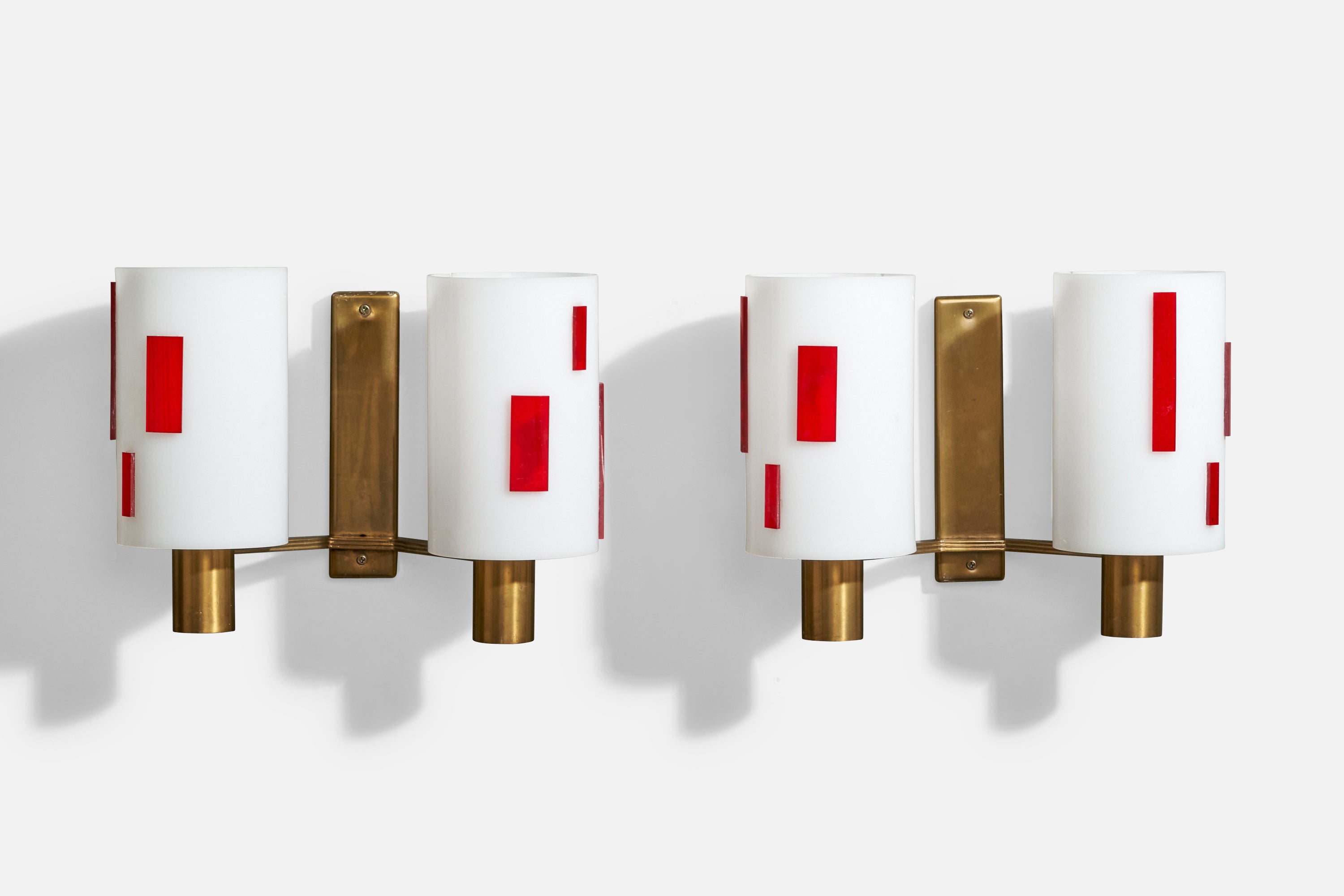 A pair of brass, red and white acrylic wall lights designed and produced in Italy, c. 1960s.

Overall Dimensions (Inches): 9.5” H x 12.5” W x 6“ D

Back Plate Dimensions (Inches): 7.5” H x 1.8” W x .75” D

Bulb Specifications: E-26

Number of