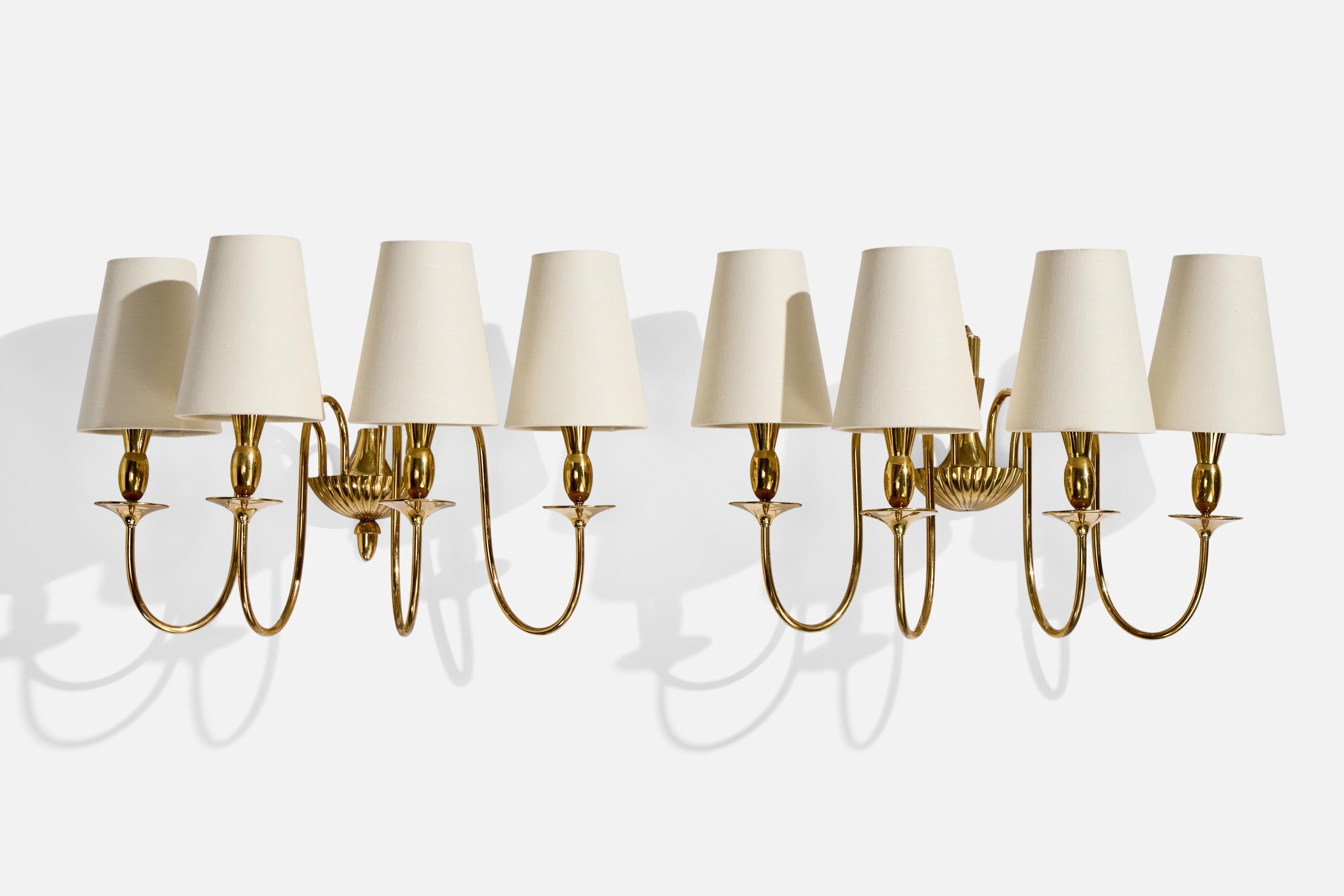 A pair of sizable brass and white fabric wall lights designed and produced in Italy, c. 1950s.

Top ornament of backplate on one fixture is missing; bottom ornament missing from the other fixture’s backplate.

Overall Dimensions (Inches): 14” H x