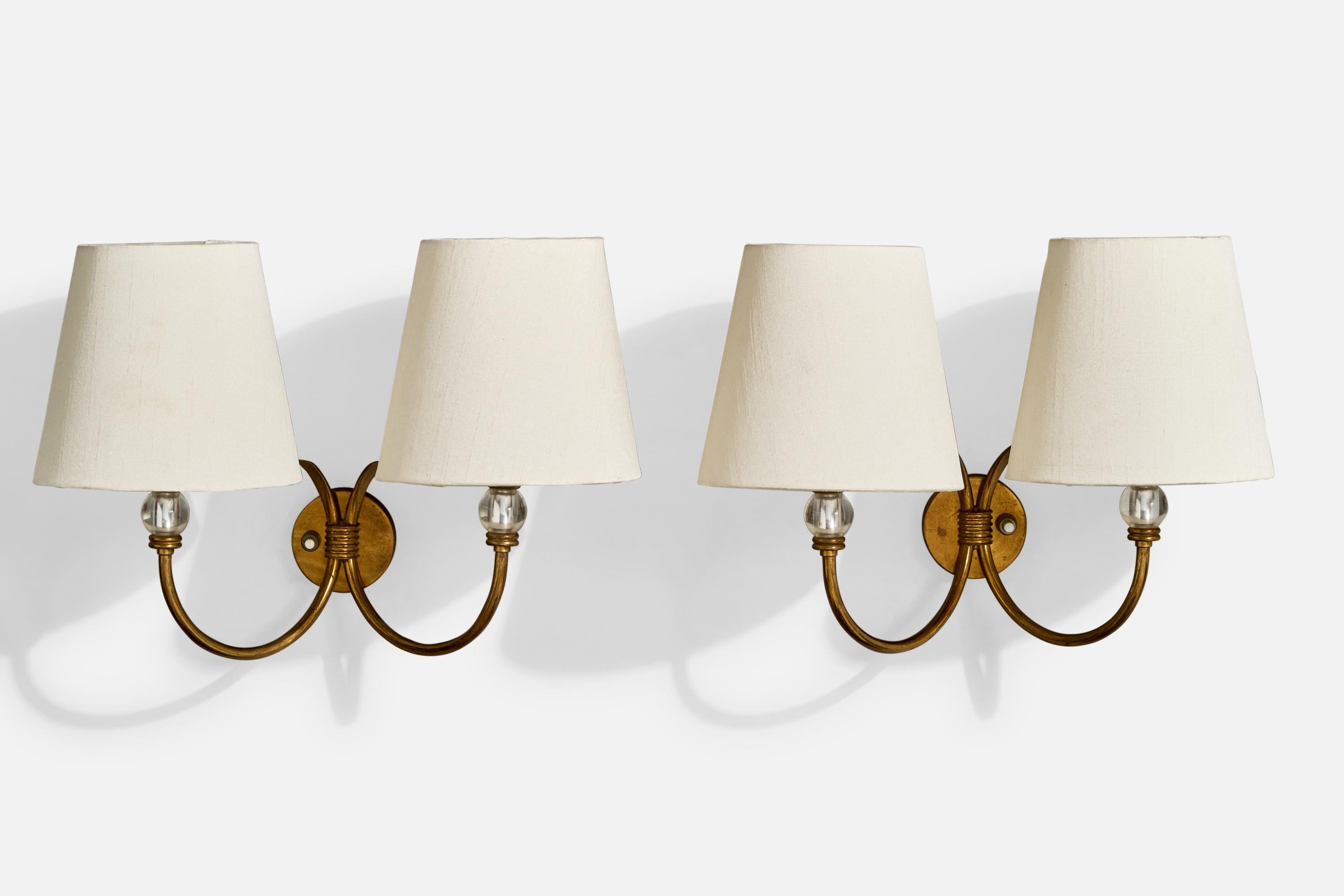 A pair of brass, glass and white fabric wall lights designed and produced in Italy, c. 1950s.

The brass arms and backplate present with light to moderate oxidation. 

Brand new fabric shades.

Overall Dimensions (Inches): 9.8” H x 13.75” W x 7“