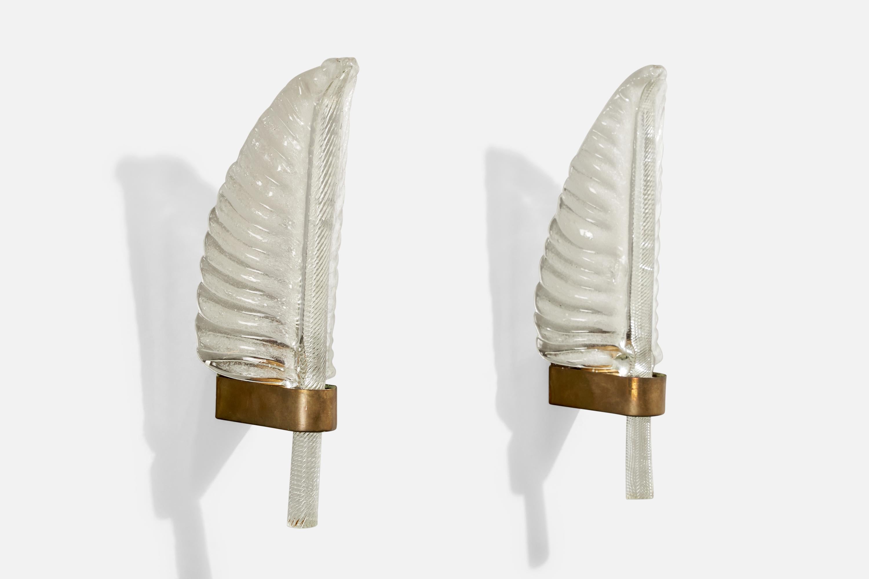 A pair of brass and Murano glass wall lights designed and produced in Italy, c. 1940s.

Overall Dimensions (inches):  13” H x  4.75” W x  3.75” D

Back Plate Dimensions (Inches):  1.5” H x 1.625” W x .875” D

Bulb Specifications: E-26

Number of