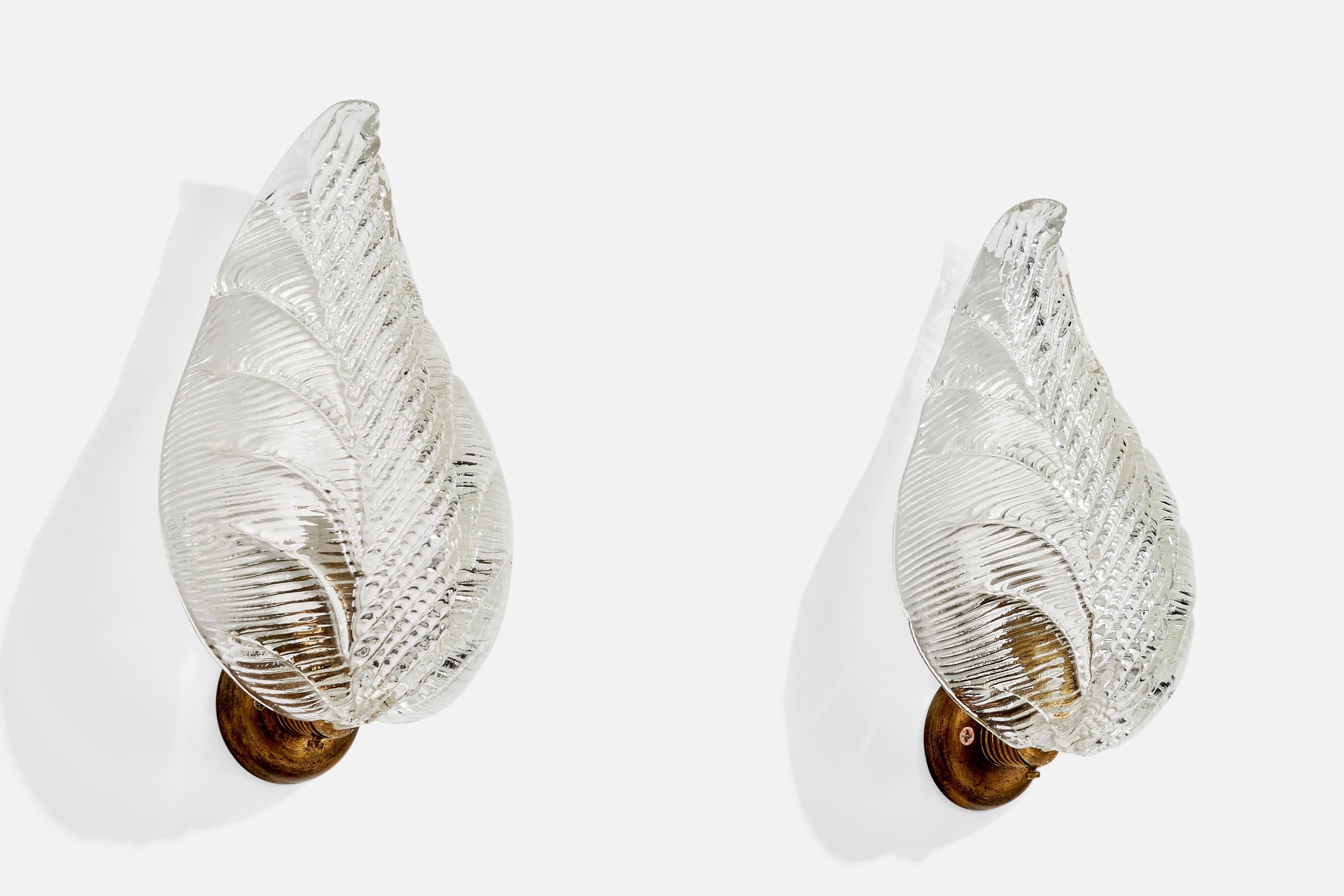 A pair of brass and glass wall lights designed and produced in Italy, c. 1940s.

Overall Dimensions (Inches): 11” H x 6” W x 4.25“ D

Back Plate Dimensions (Inches): 2.5” Diameter x .45” D

Bulb Specifications: E-14

Number of Sockets (per fixture):