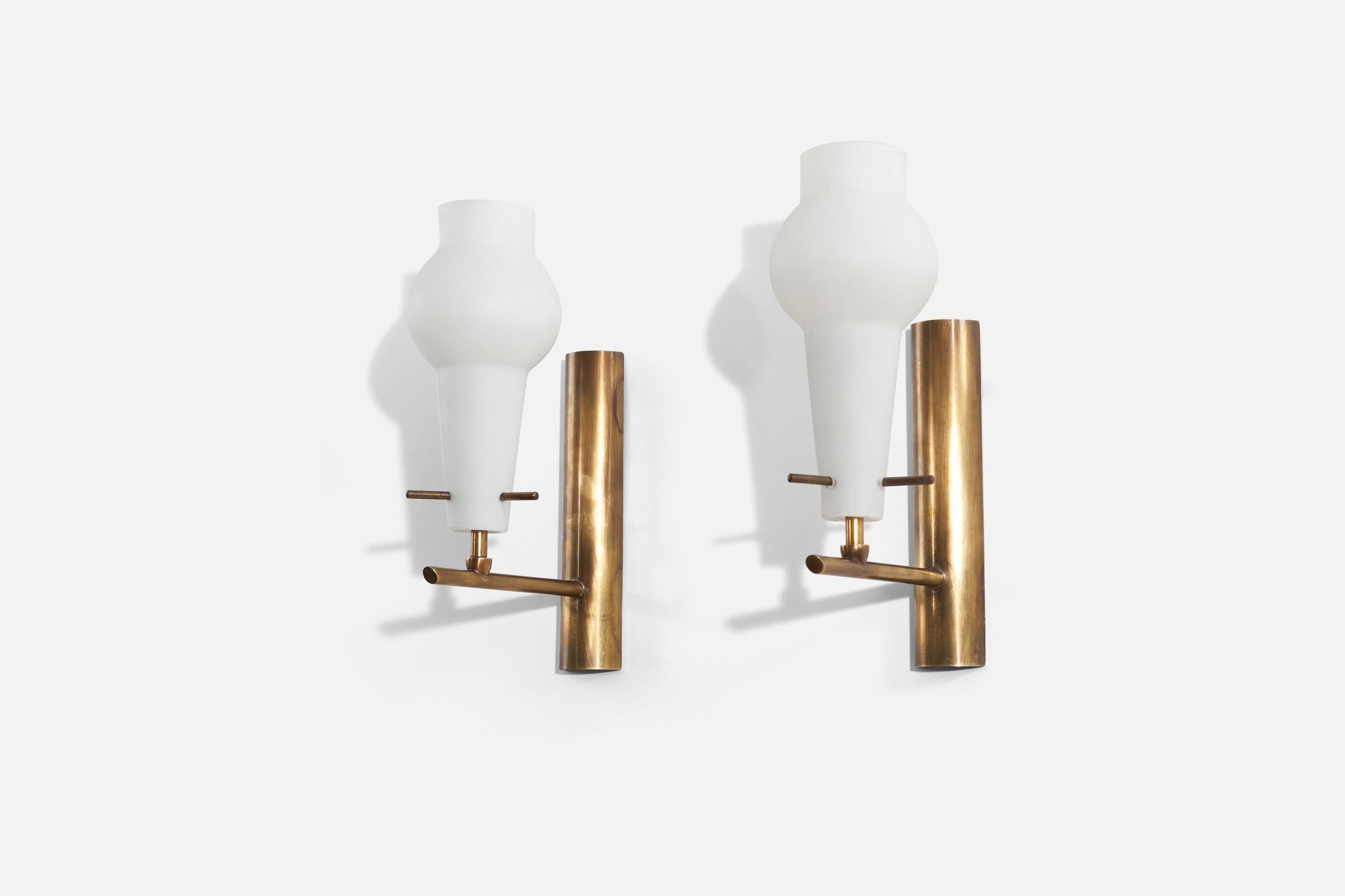 A pair of brass and glass wall lights designed and produced by an Italian designer, Italy, 1950s.