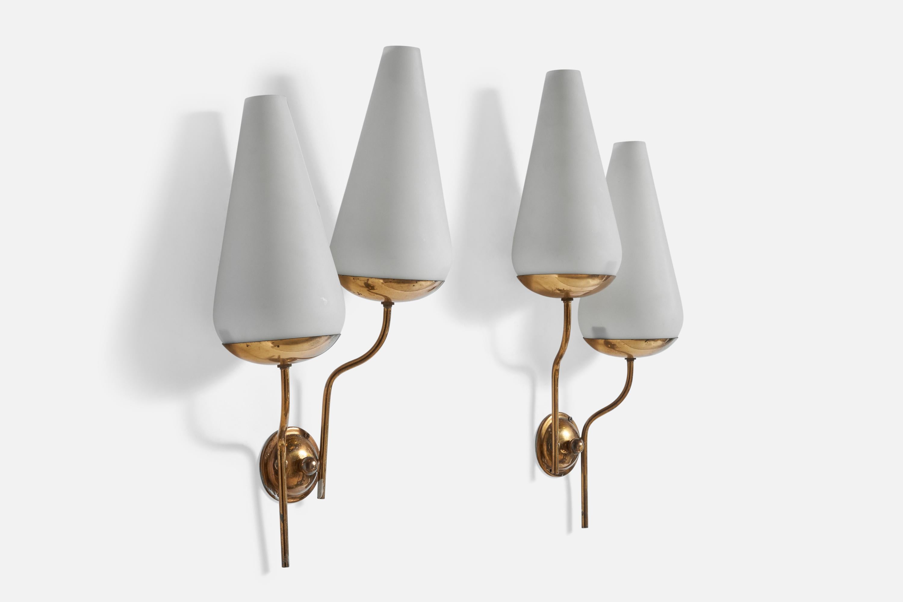A pair of brass and opaline glass wall lights designed and produced in Italy, 1950s.

Overall Dimensions (inches): 18.5” H x 9” W x 5.5” D
Back Plate Dimensions (inches): 2.9 diameter x 1.25” depth
Bulb Specifications: E-14 Bulbs
Number of Sockets: