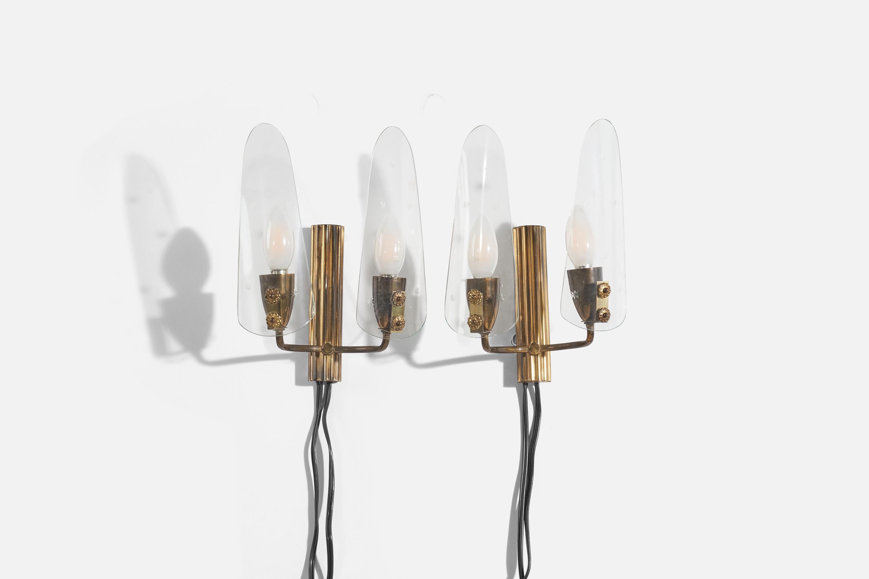 A pair of brass wall lights designed and produced by an Italian designer, Italy, 1950s.